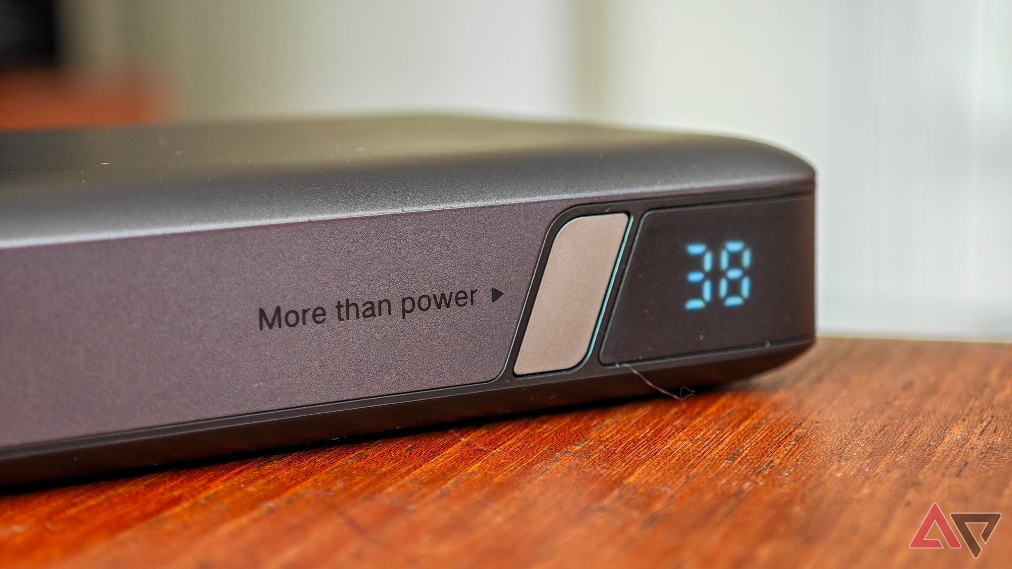 Ugreen Nexode 100W 20,000mah Bank on a wooden table showing the remaining battery capacity