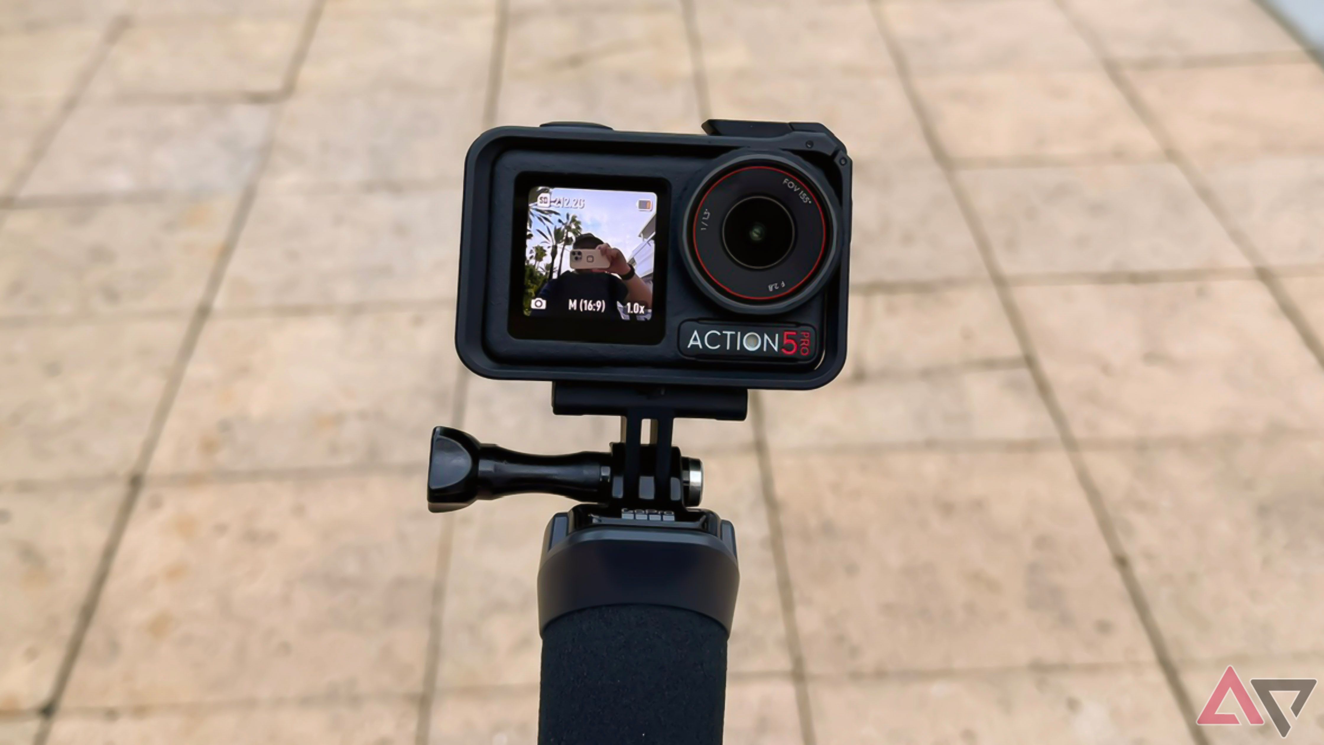 The DJI Osmo Action 5 Pro mounted on a floaty grip.