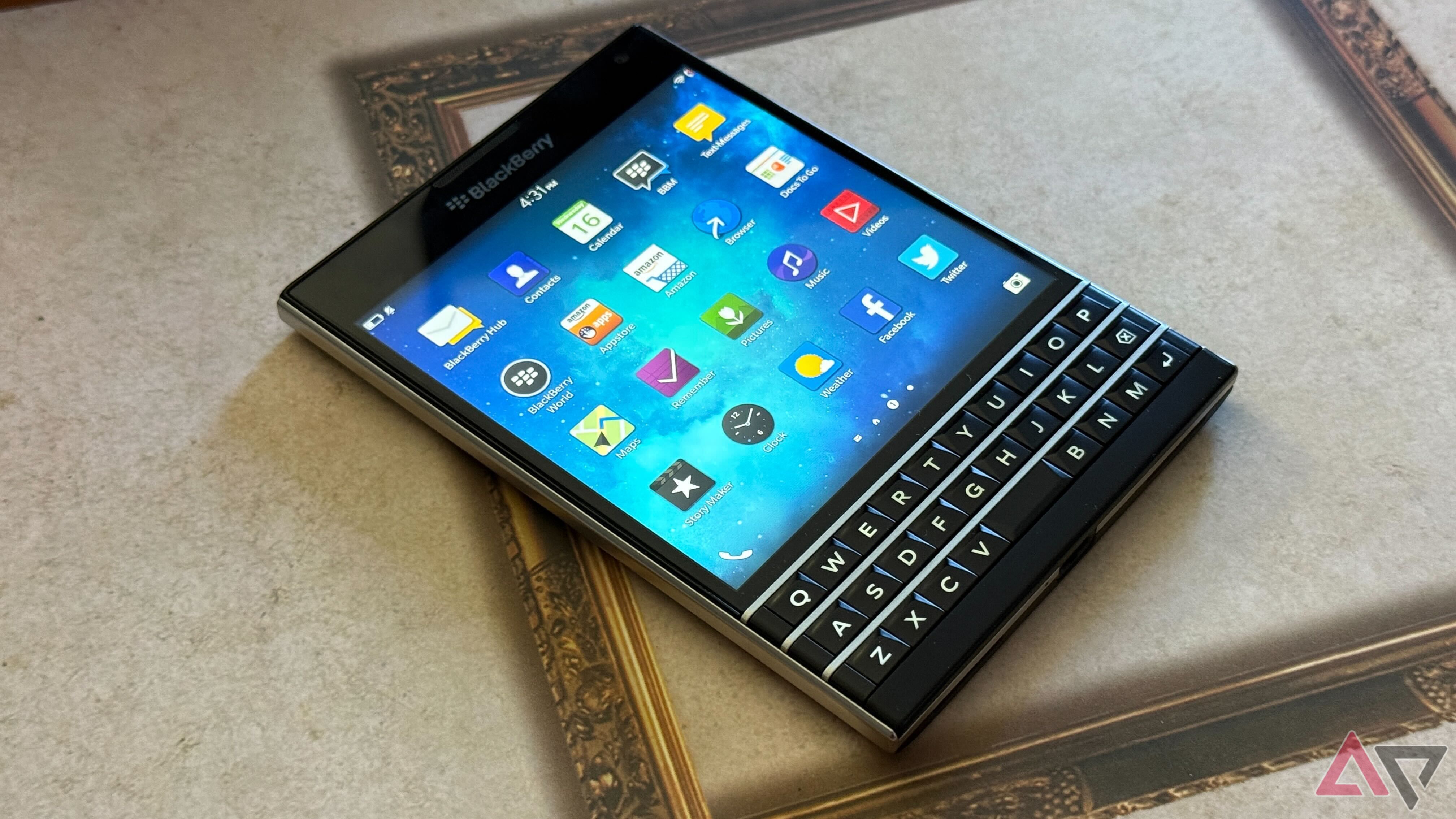 Blackberry passport sitting on a table with screen turned on