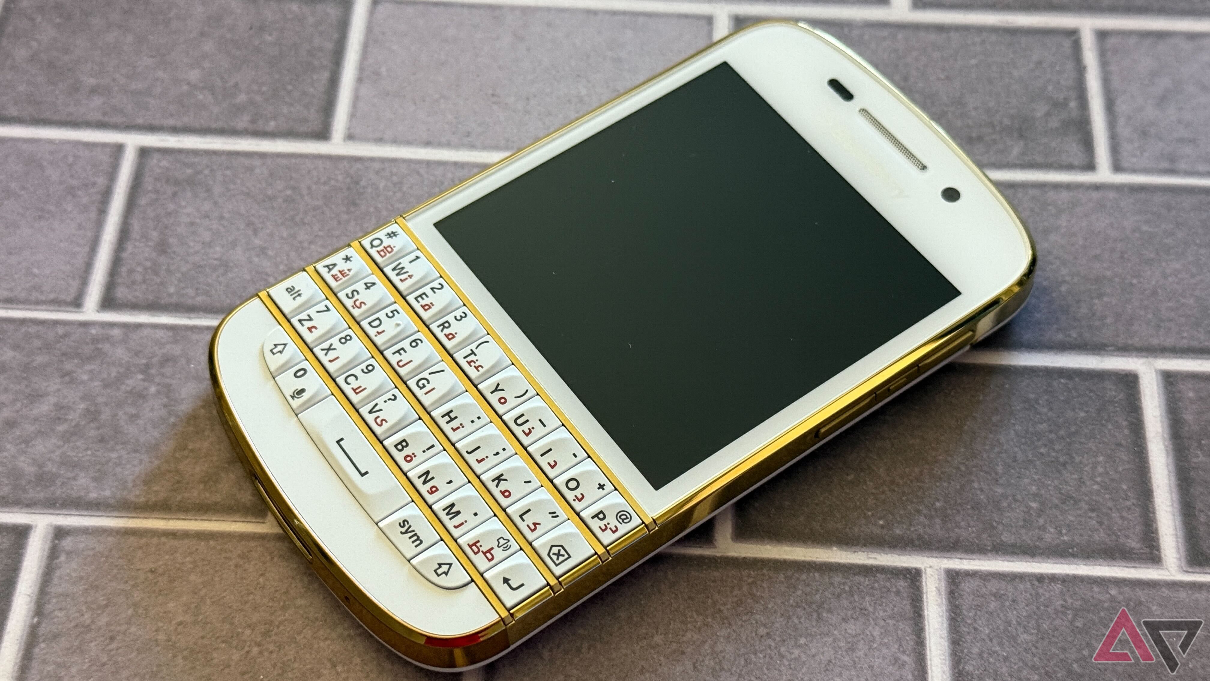 BlackBerry Q10 Special Edition on a brick with screen off