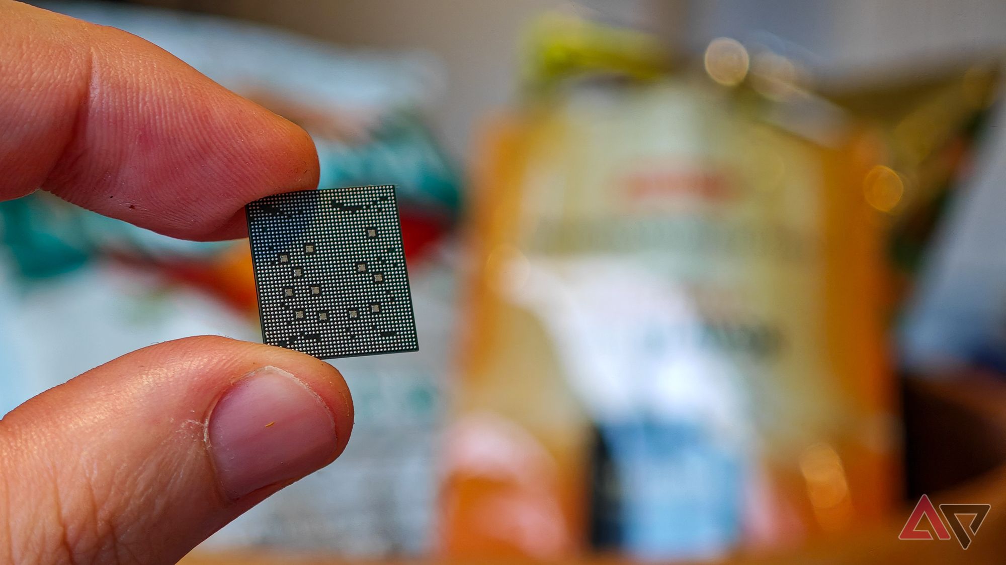 MediaTek Dimensity 9400 chip held in a hand with the silicon facing the camera