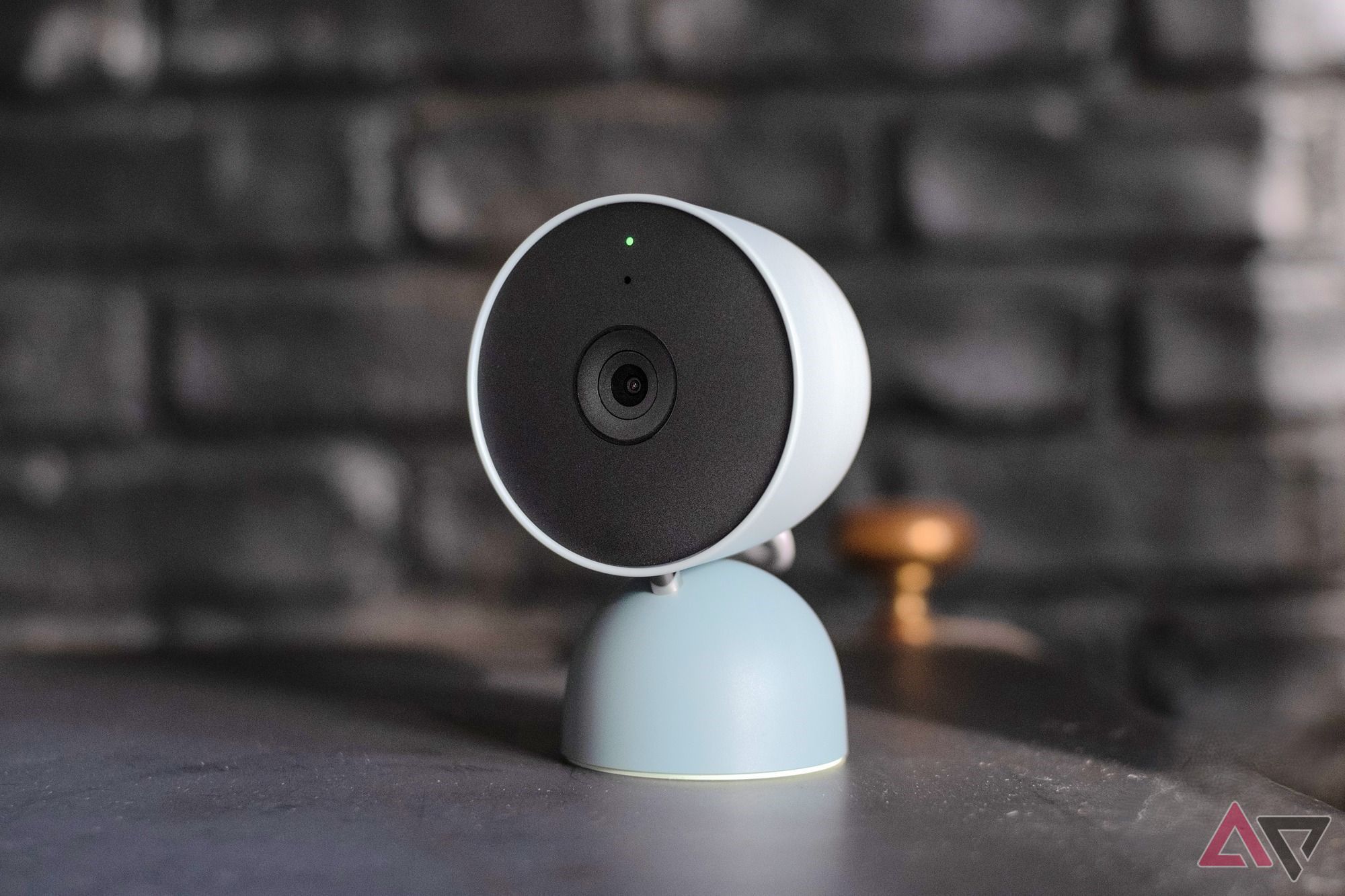 A Google Nest indoor wired camera sitting on a table top