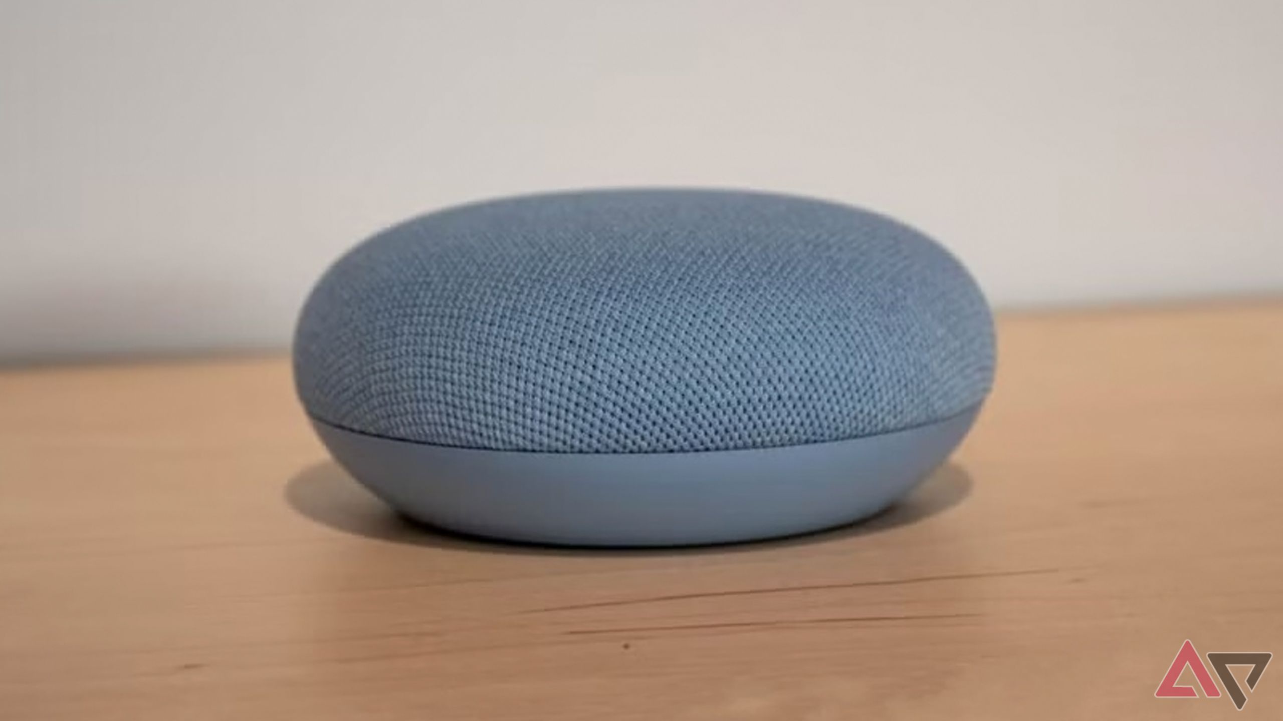 A Nest Mini on a table.