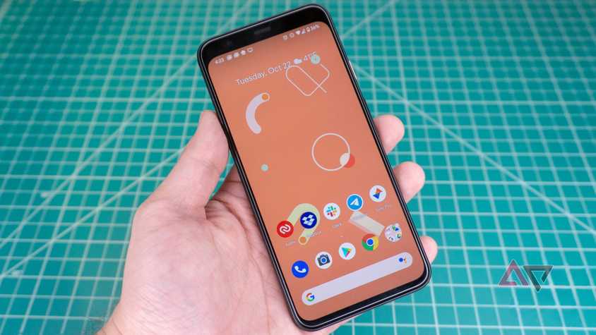 Pixel 4 held in hand in front of hobby mat