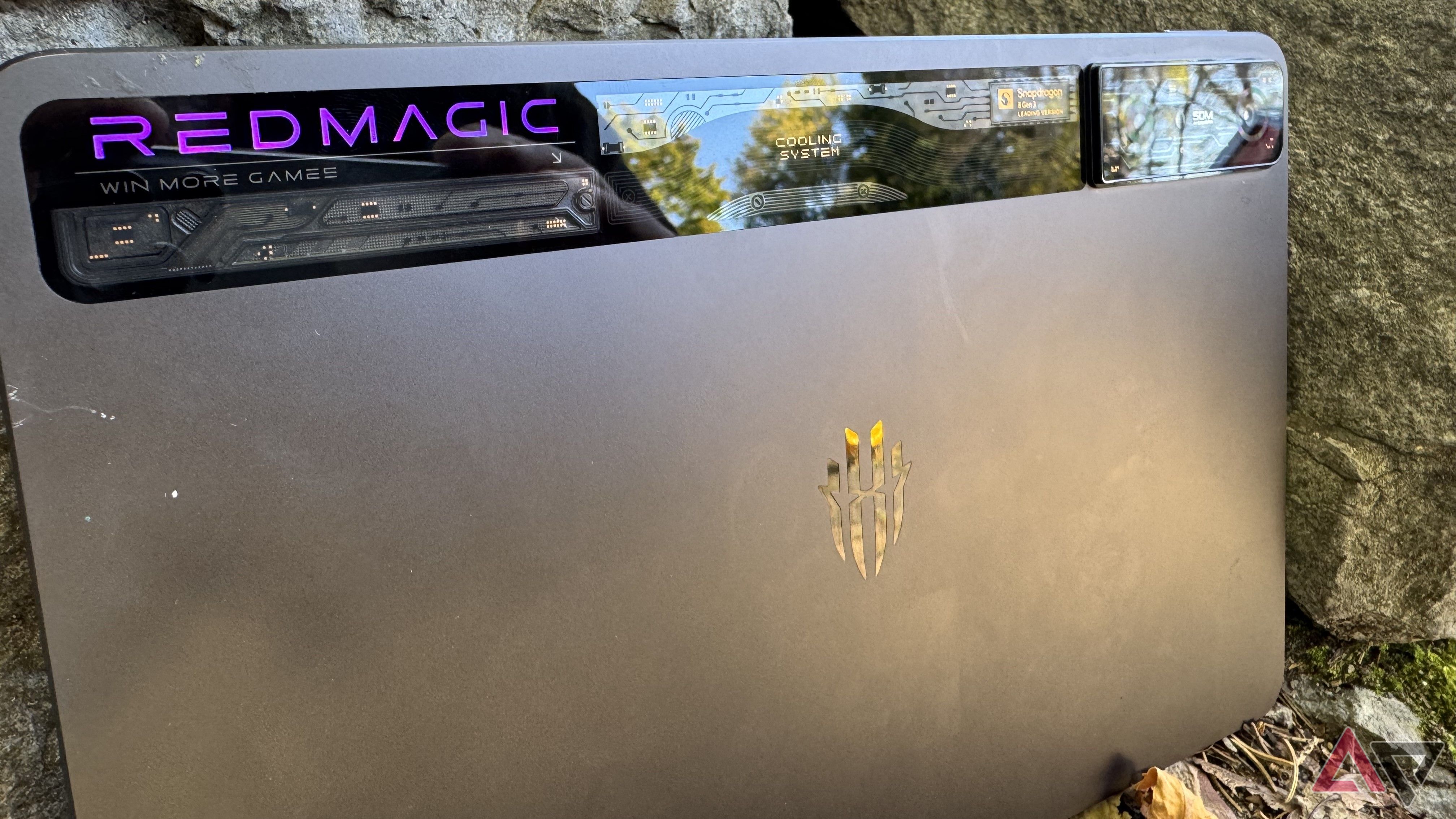 A Redmagic Nova gaming tablet on some rocks.
