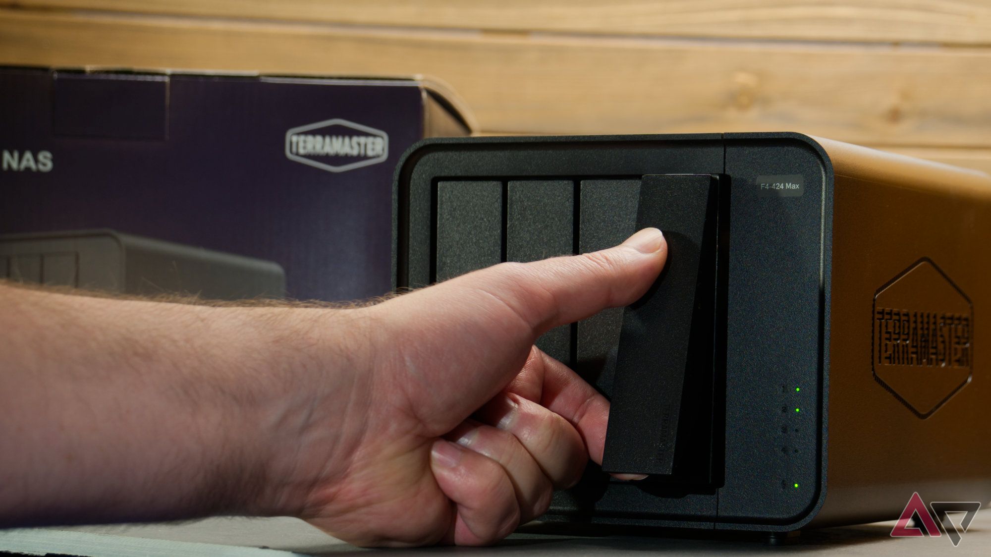 Hand pulling out the drive bay of a NAS
