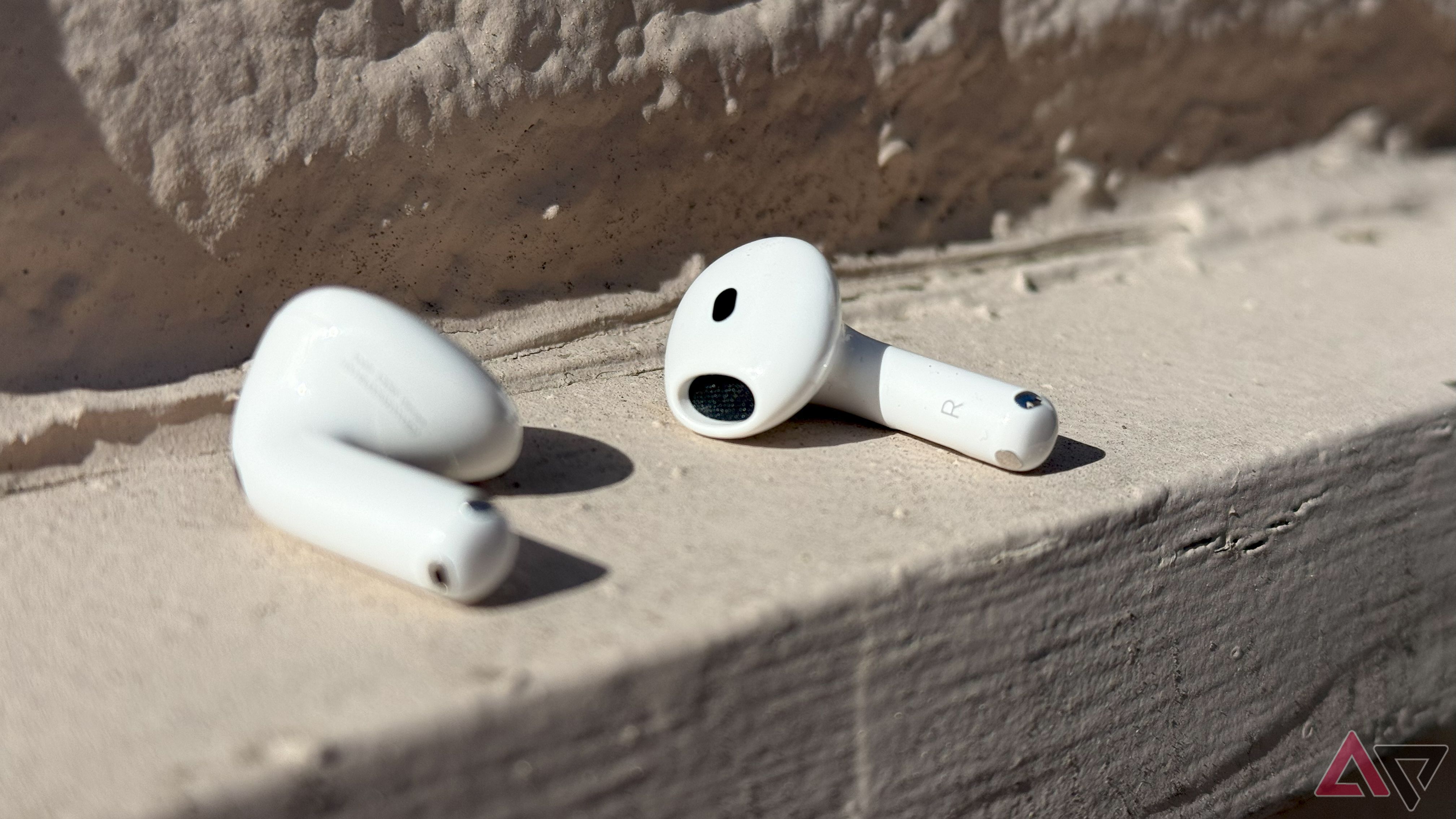 Apple's AirPods 4, both earpods without the charging case