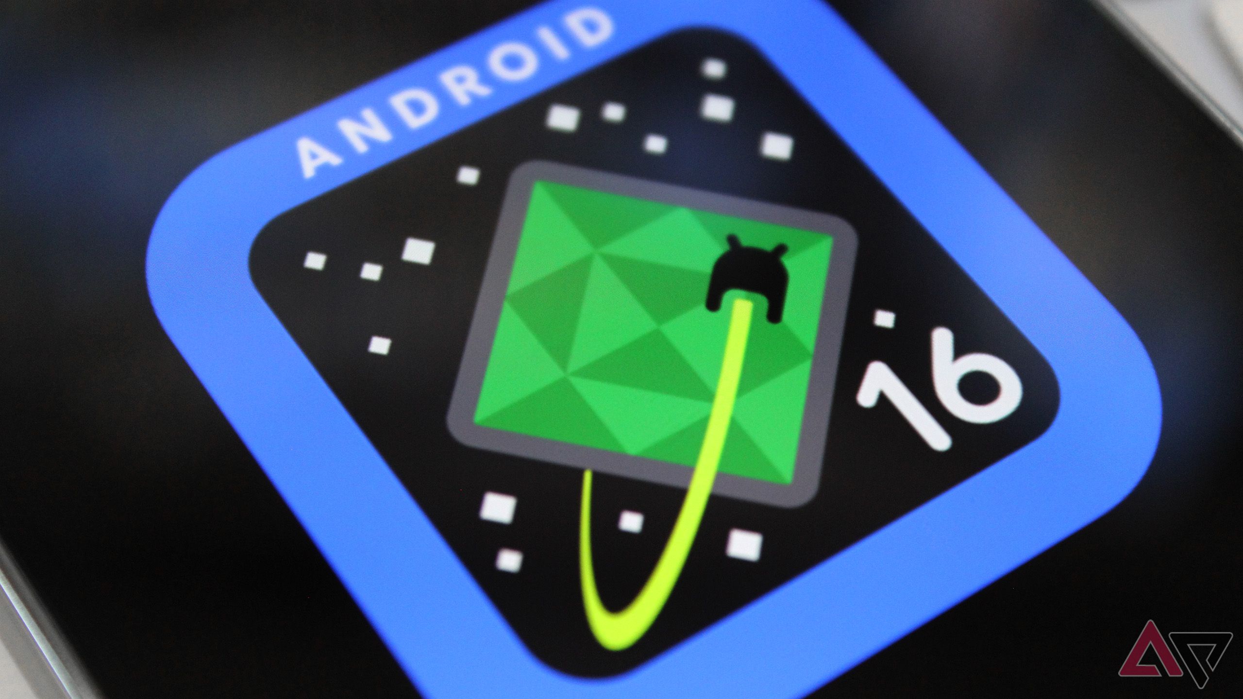 A close-cropped shot of the Android 16 logo displayed on a phone's screen.