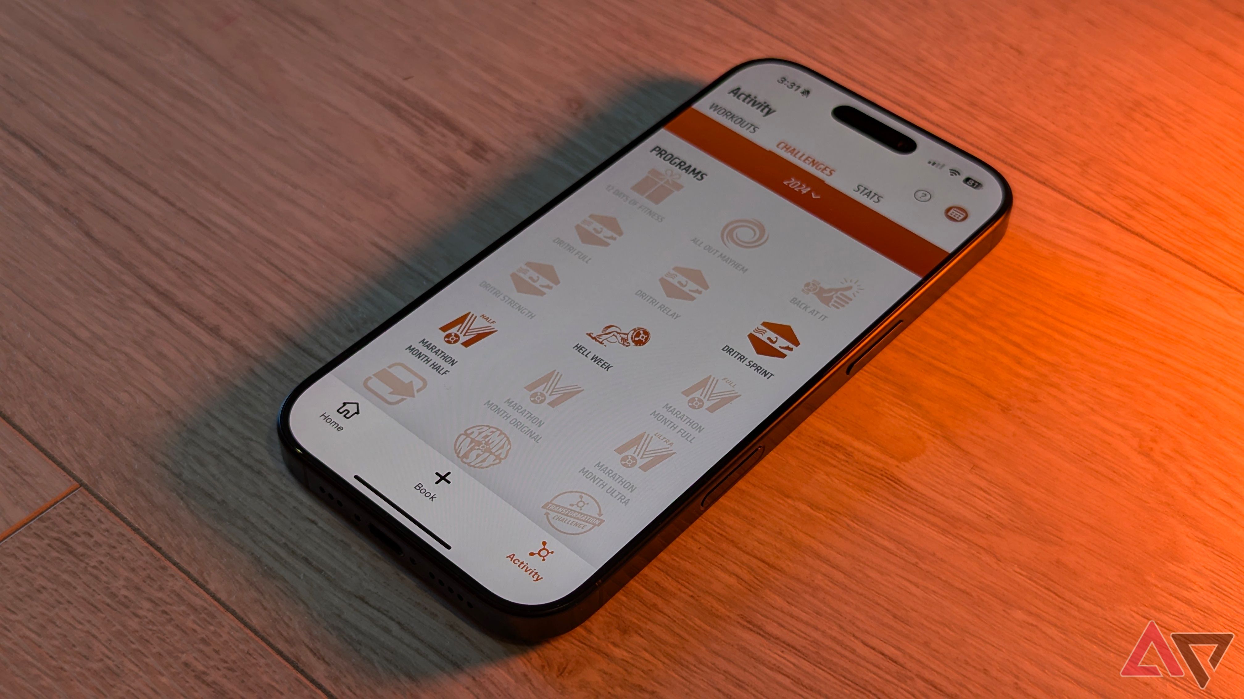 The iPhone 16 Pro, with orange light to one side