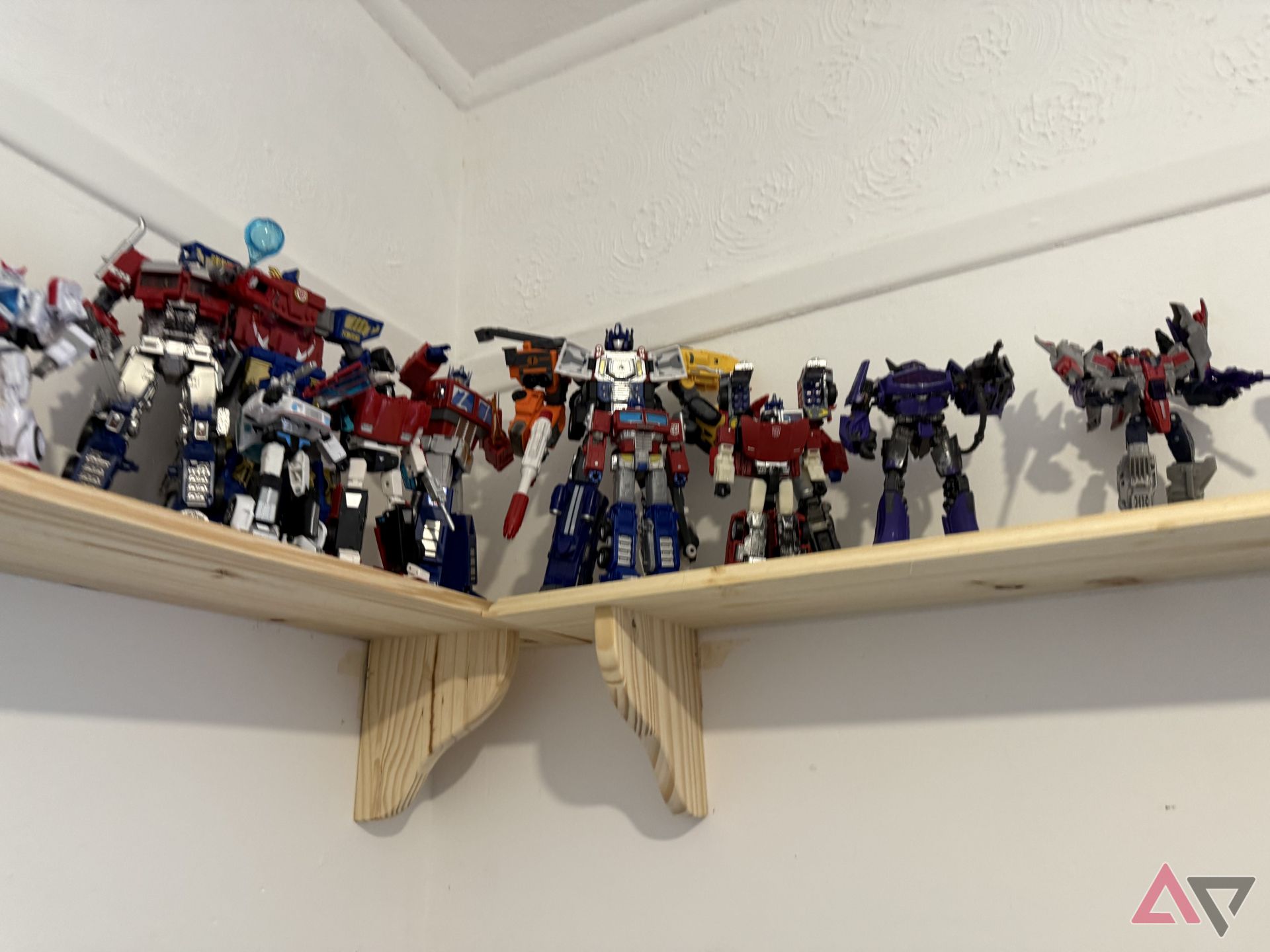 A blurry photo of Transformers on a shelf