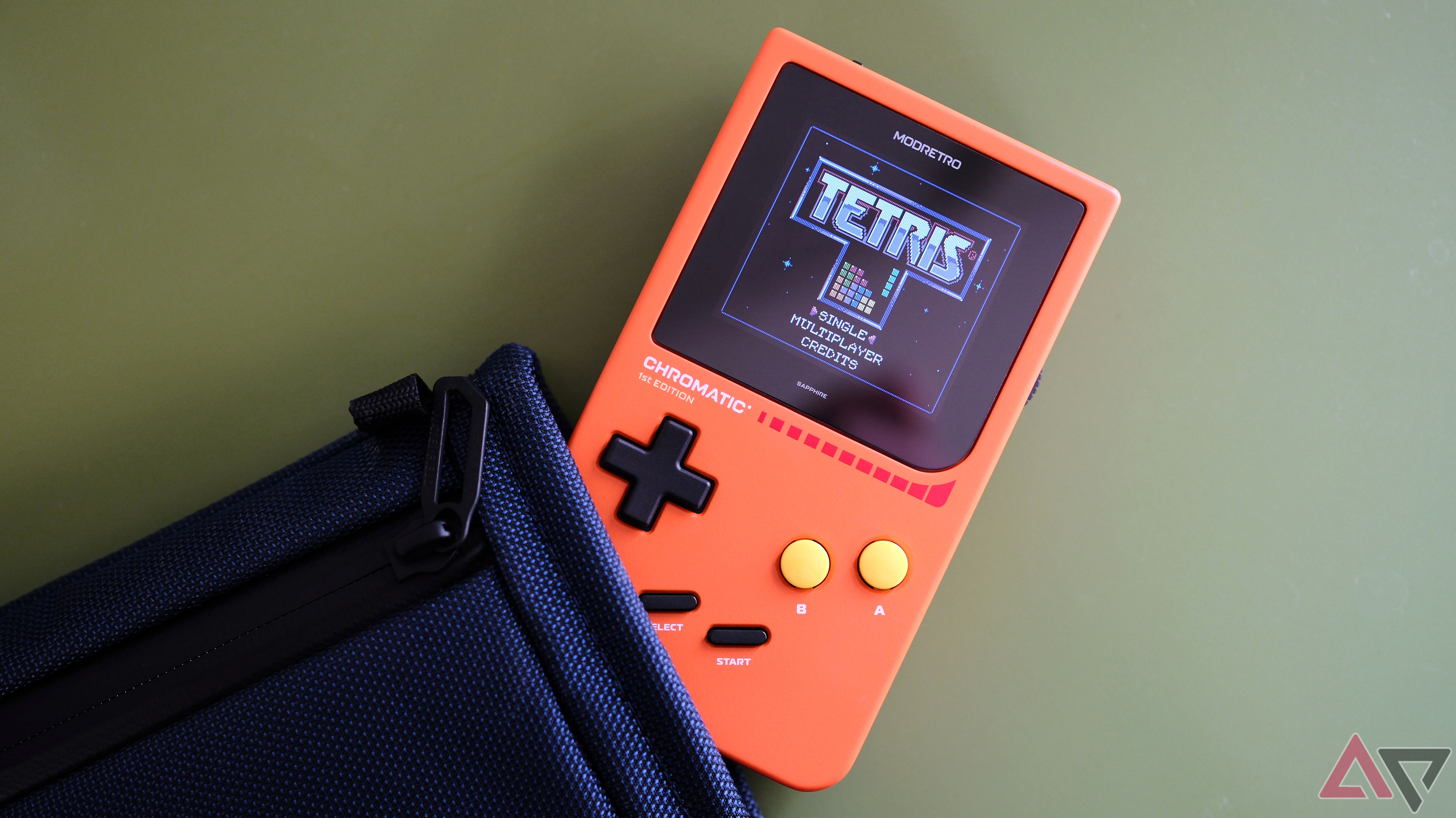 Modretro Chromatic and Waterfield Pocket Pouch on green background showing Tetris on screen