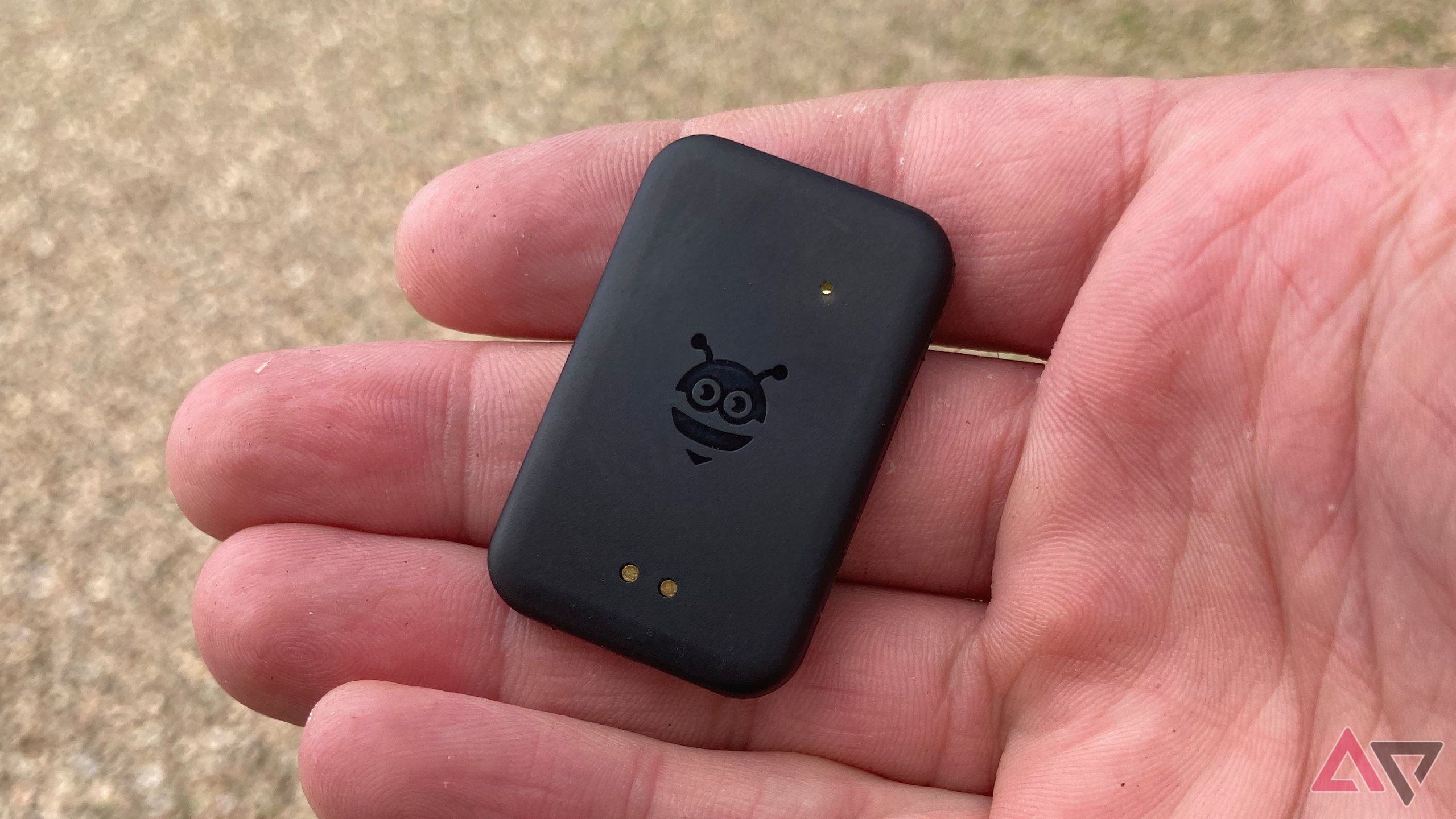 The Pebblebee Tag Universal held in a hand