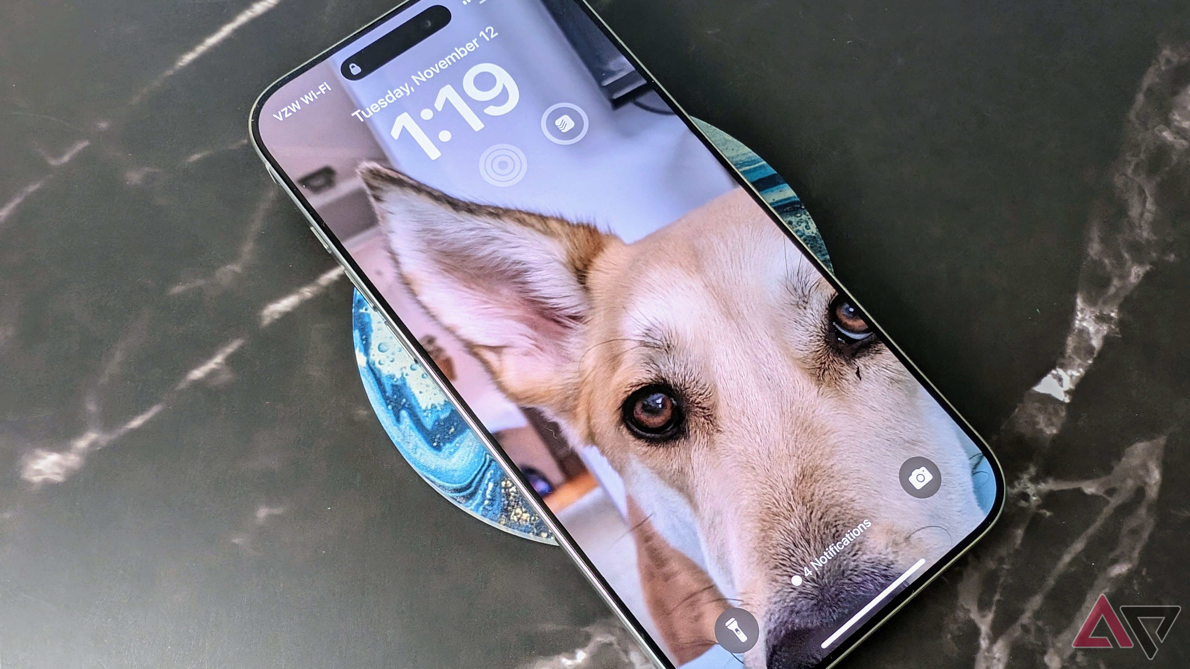 iPhone 16 Pro set on a blue coast with screen on