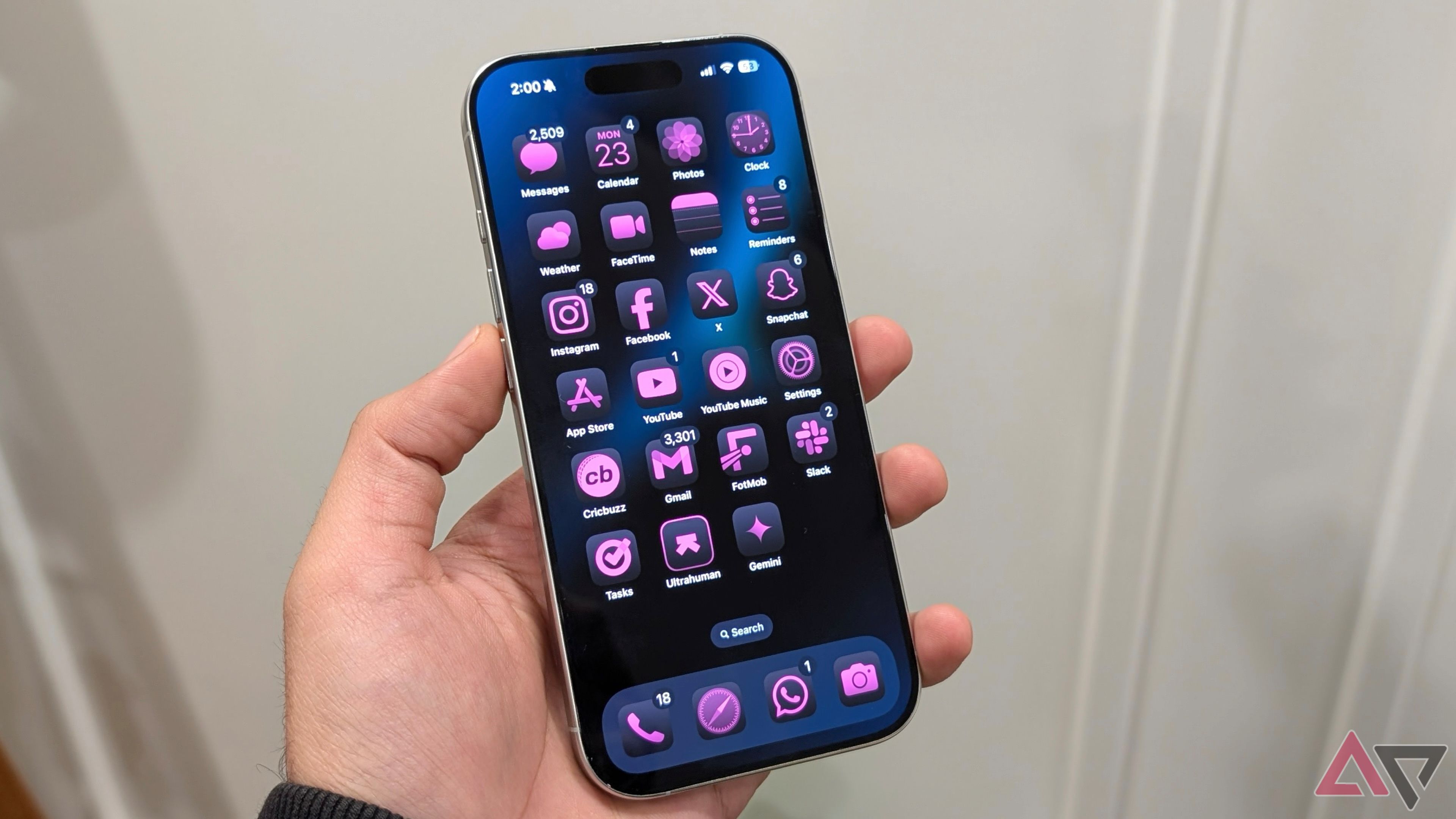 iPhone 16 Pro running iOS 18 with a custom pink theme on top