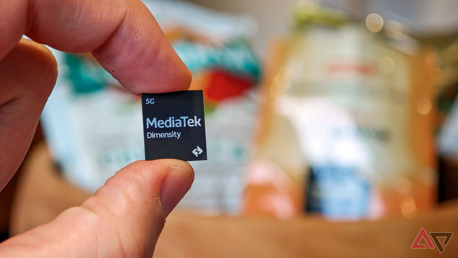 MediaTek Dimensity chip held in a hand with the logo facing the camera