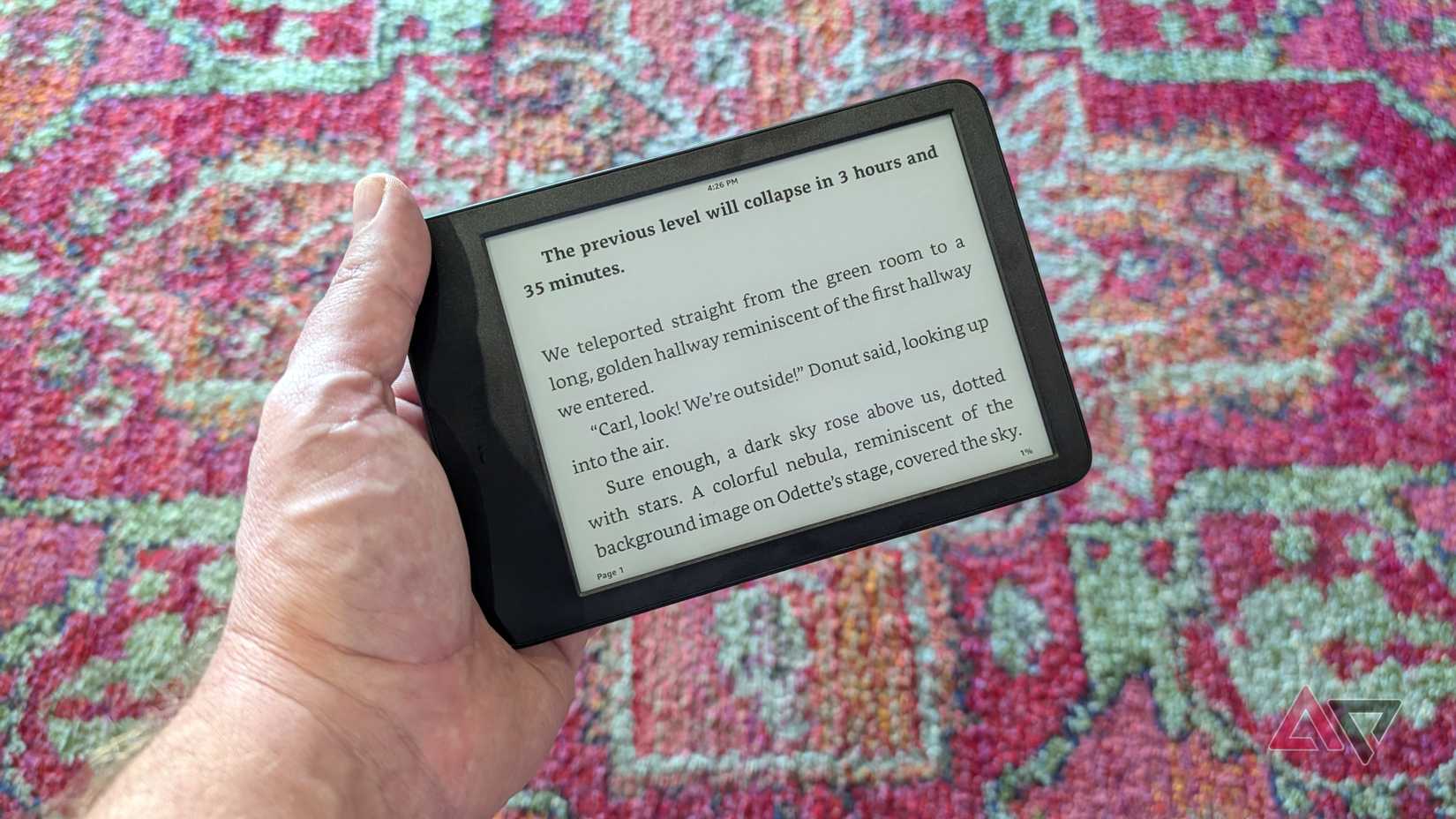 Amazon Kindle 2024 in hand in landscape reading mode