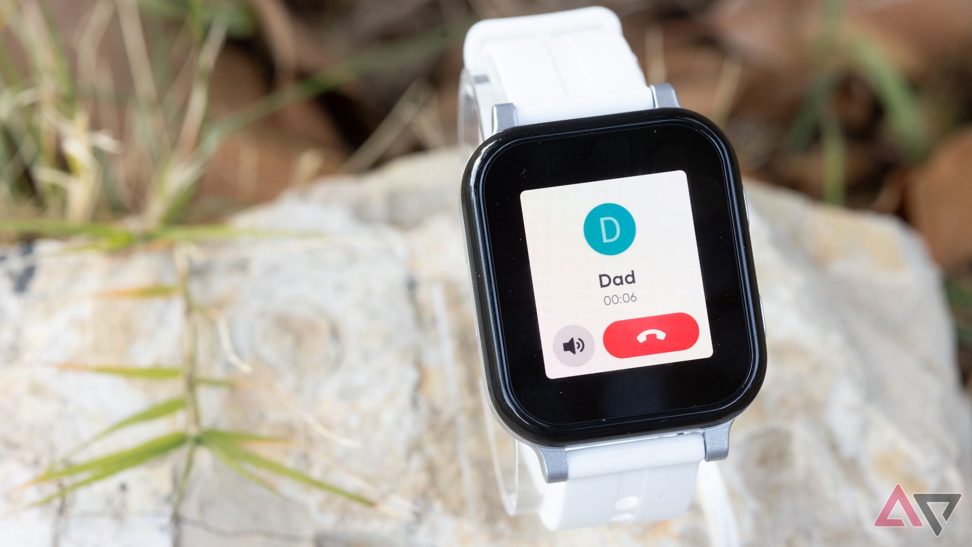 A smartwatch showing an incoming call from a dad