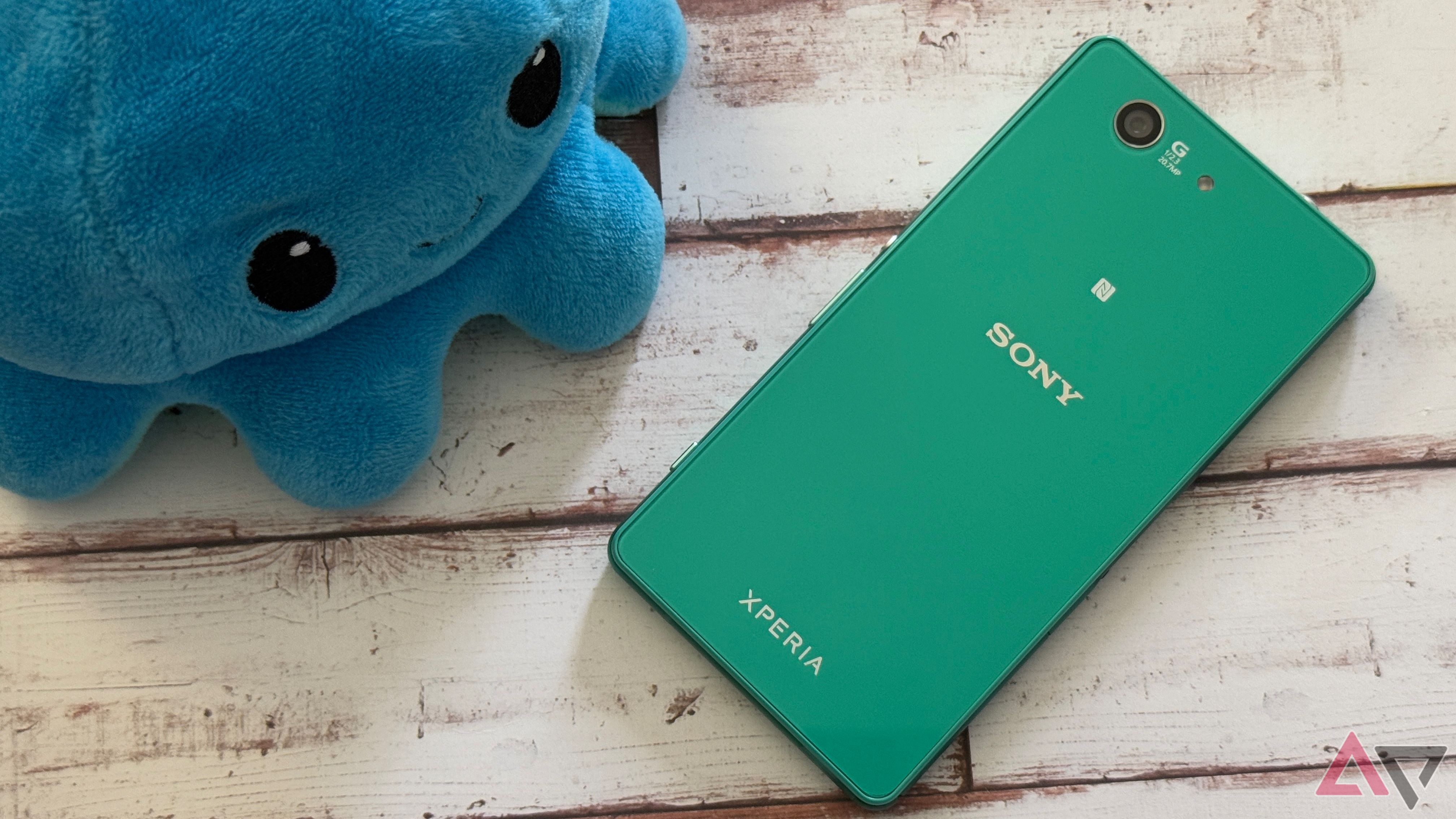 Sony Xperia Z3 Compact sitting next to a plush