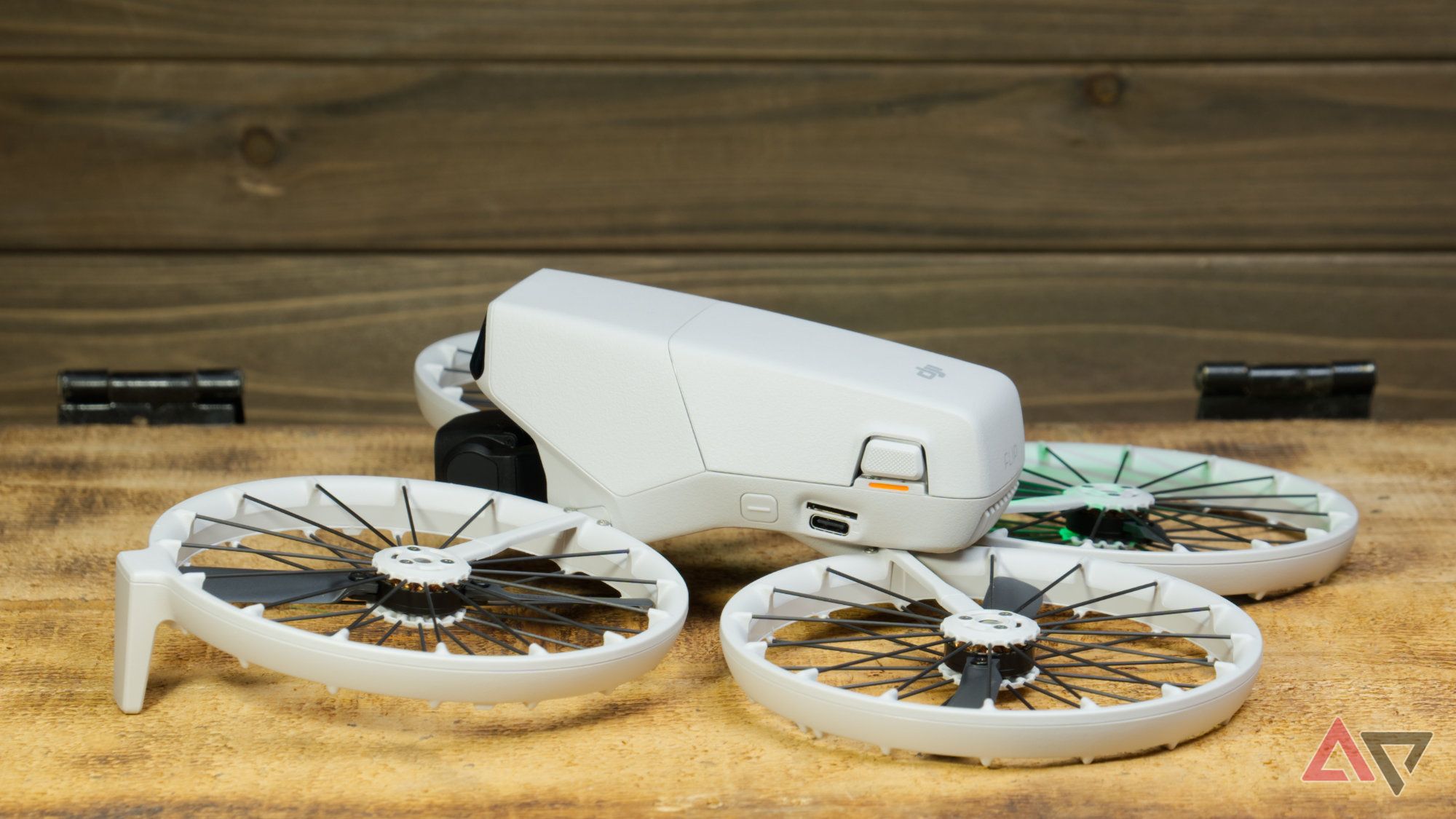 Left side of the DJI Flip showing the mode button and ports