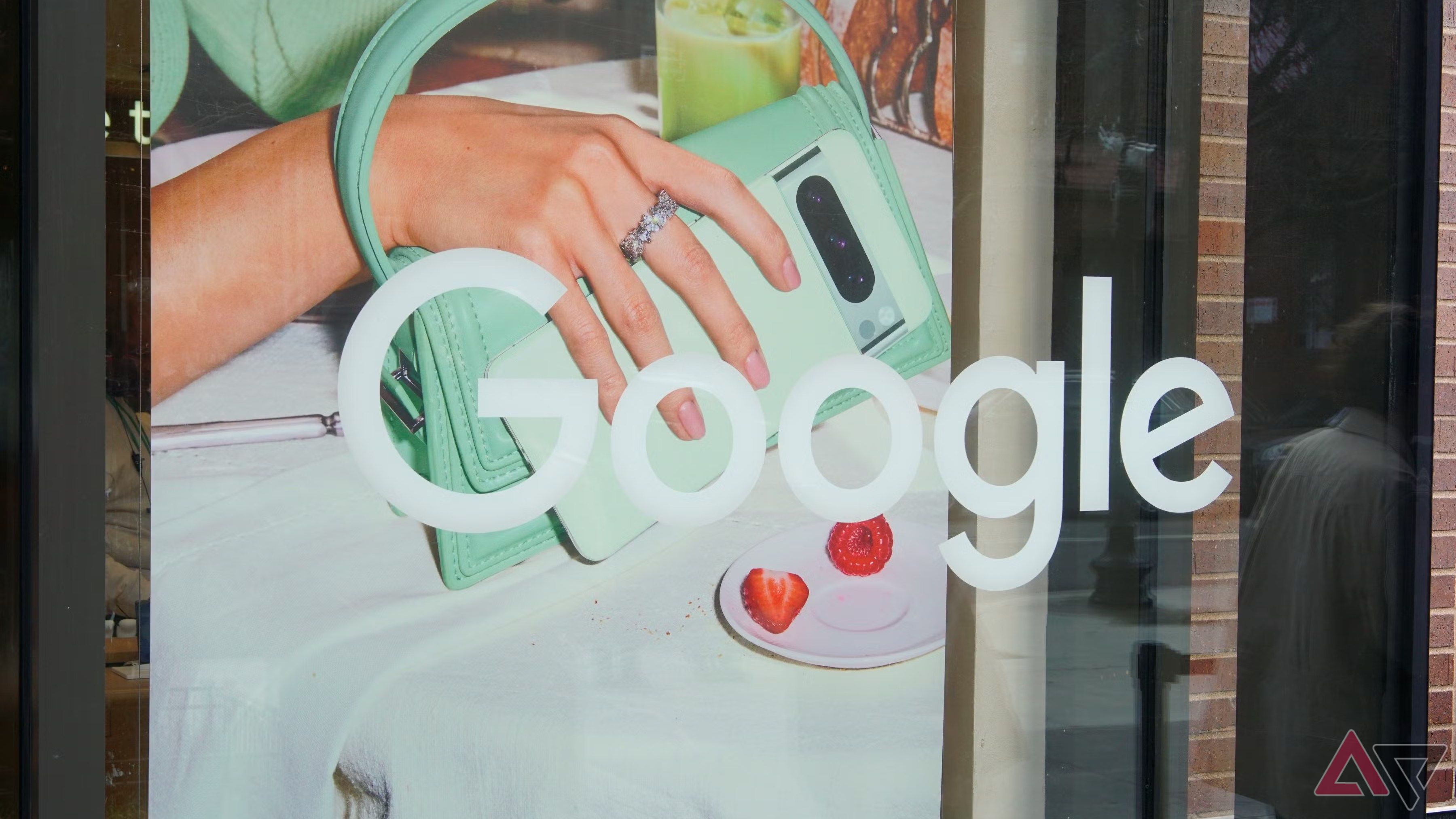 The Google wordmark printed on a window outside a retail location.