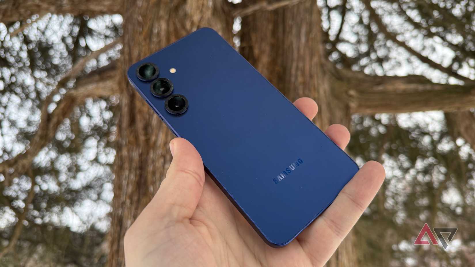 Back of the Galaxy S25+ displayed against a tree