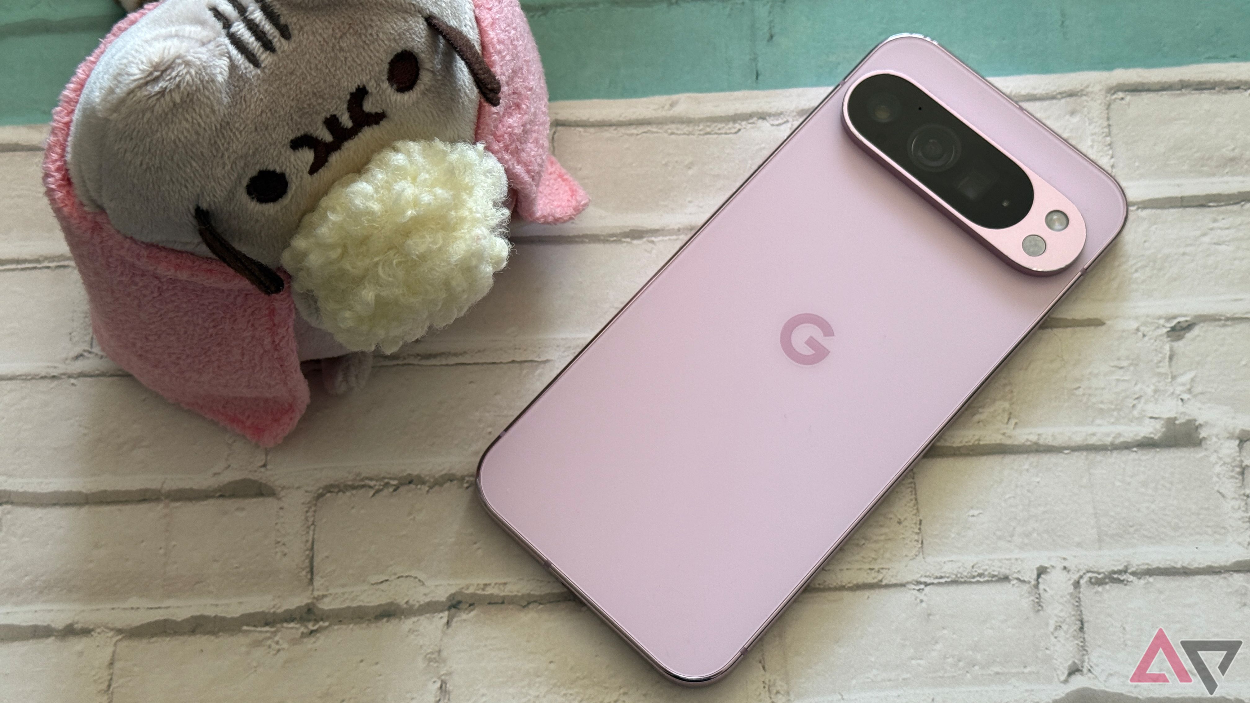 Google PIxel 9 Pro XL sitting next to Pusheen