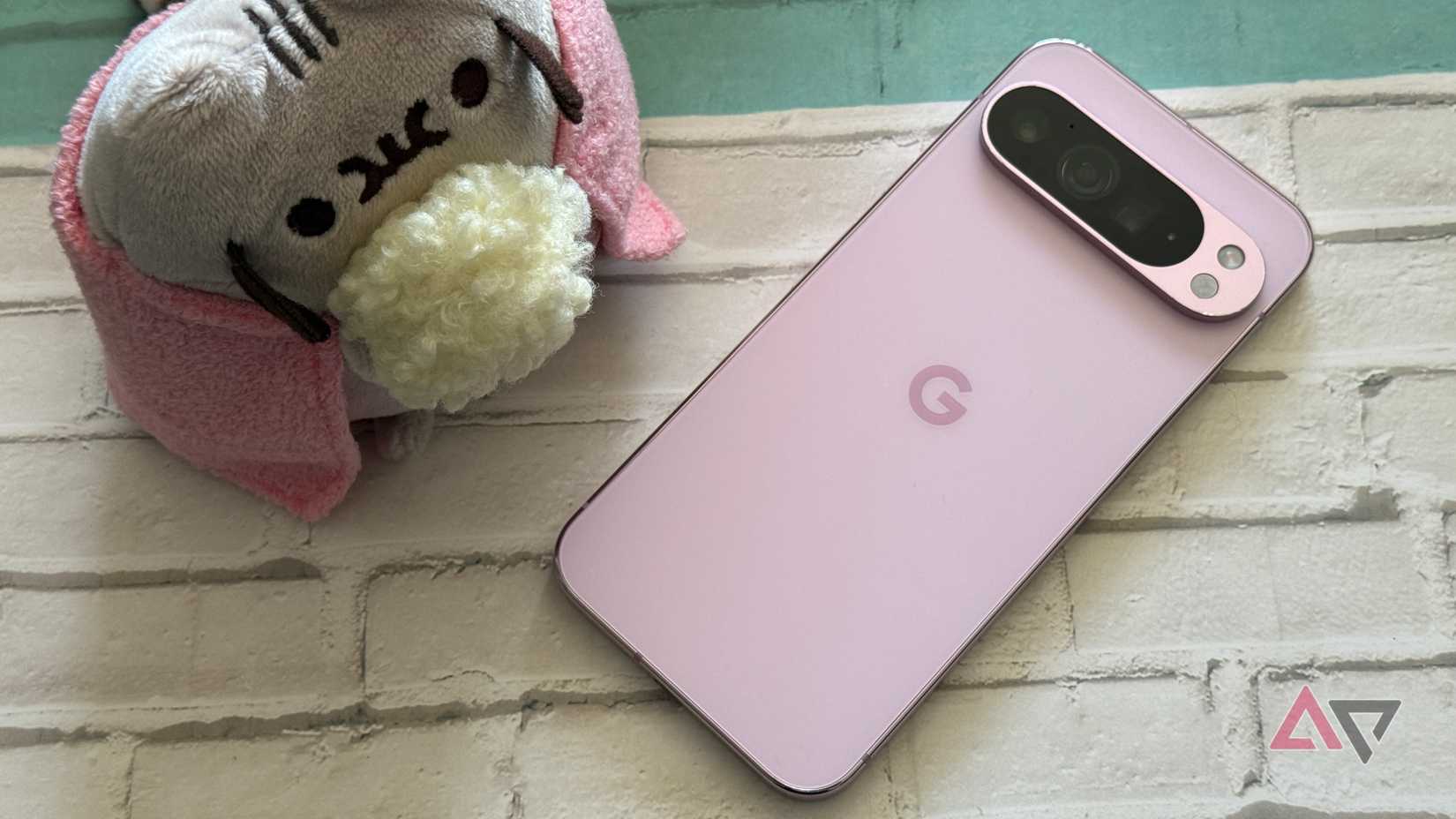 Google PIxel 9 Pro XL sitting next to Pusheen