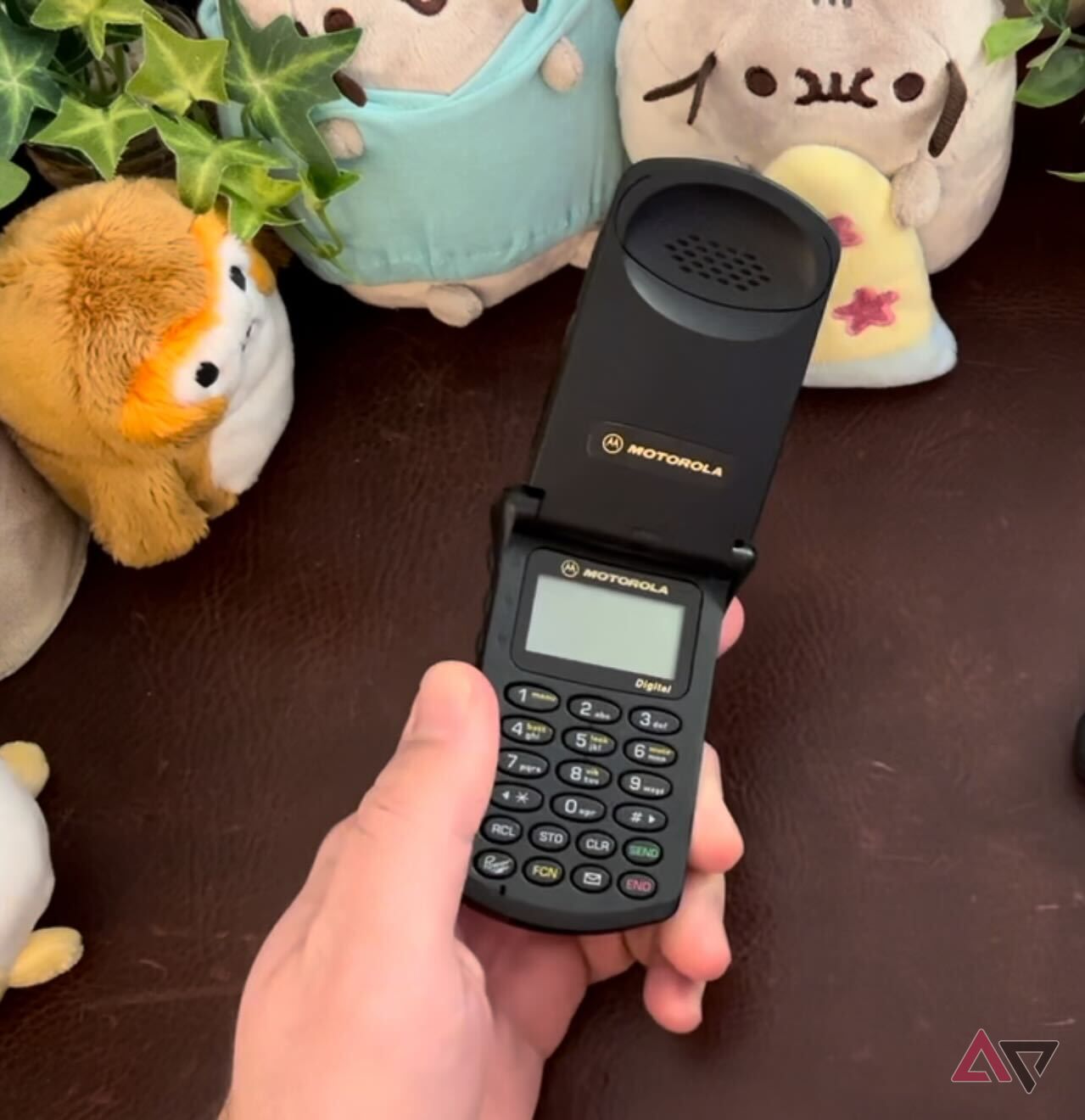 Motorola StarTAC held up against a desk