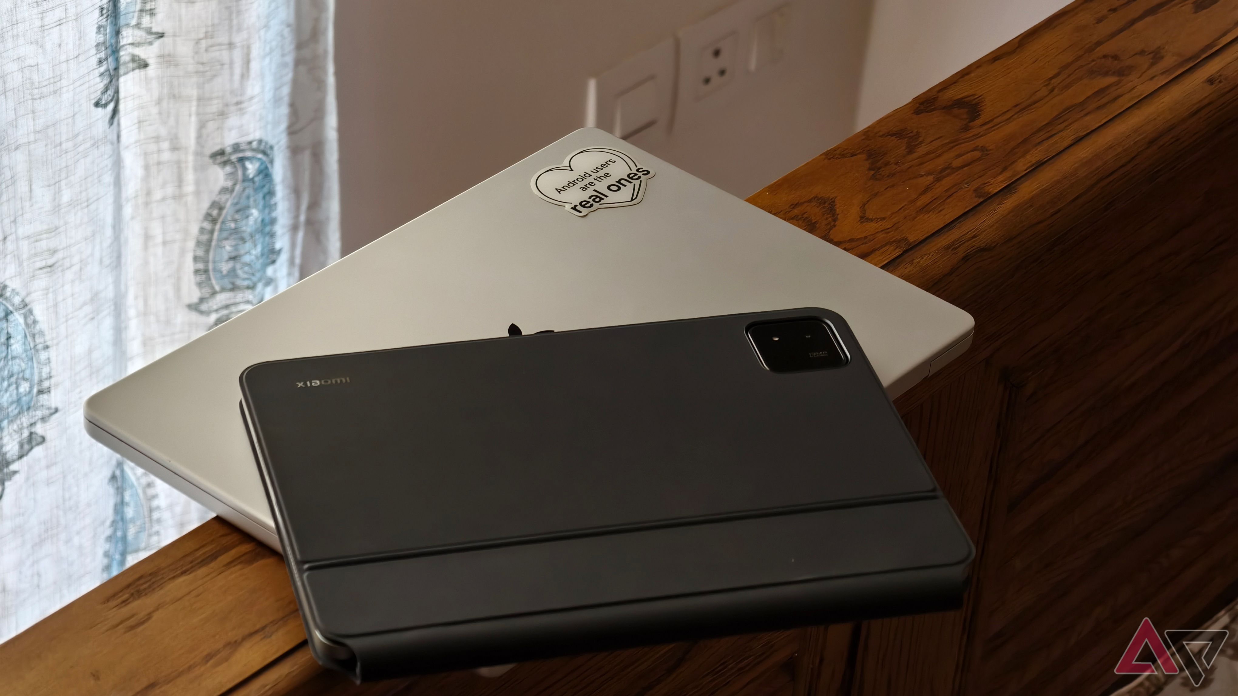 Xiaomi Pad 7 kept on top of a MacBook Pro