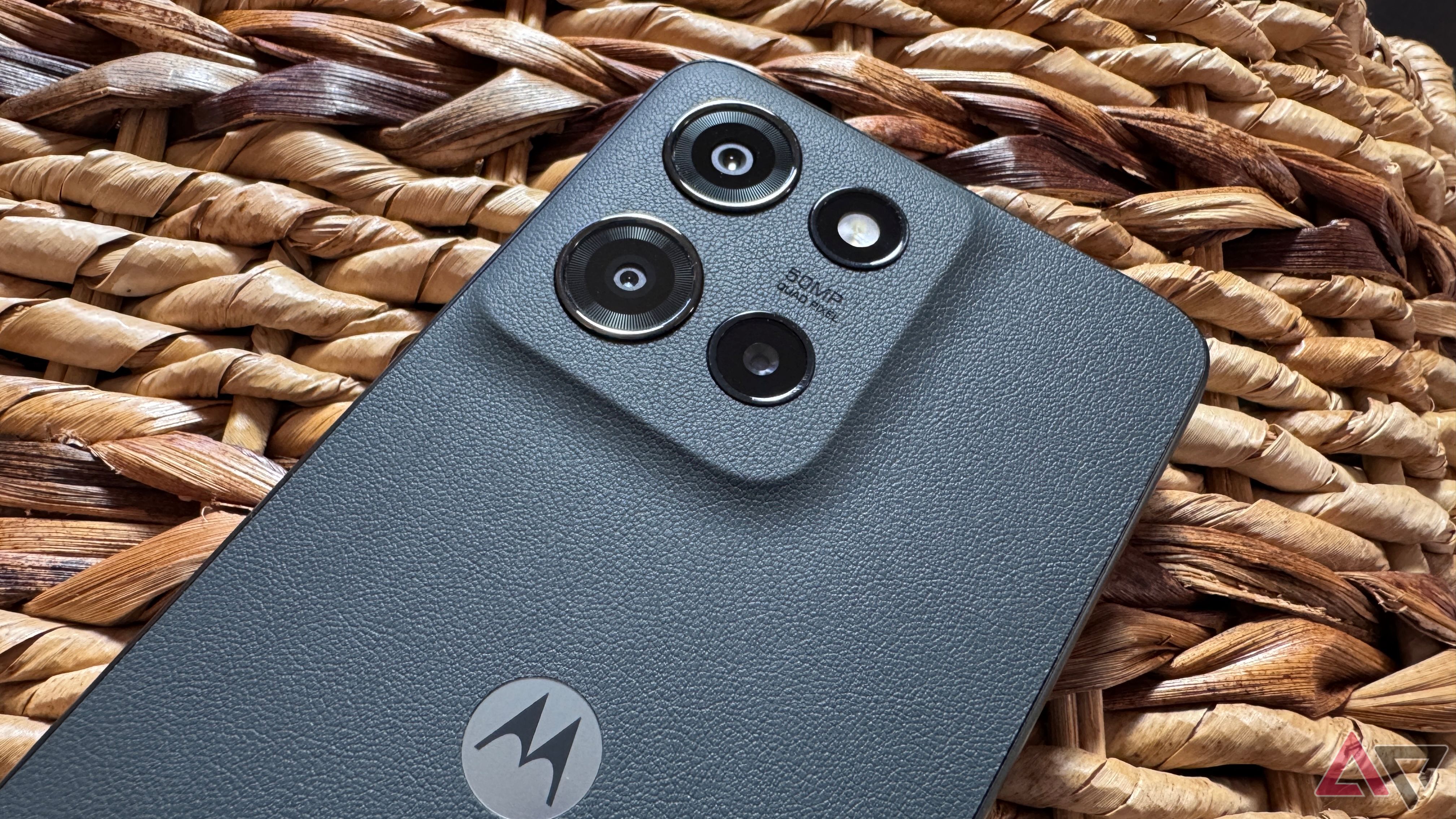 Moto G (2025) showing the vegan leather back and camera assembly on a light wicker basket.