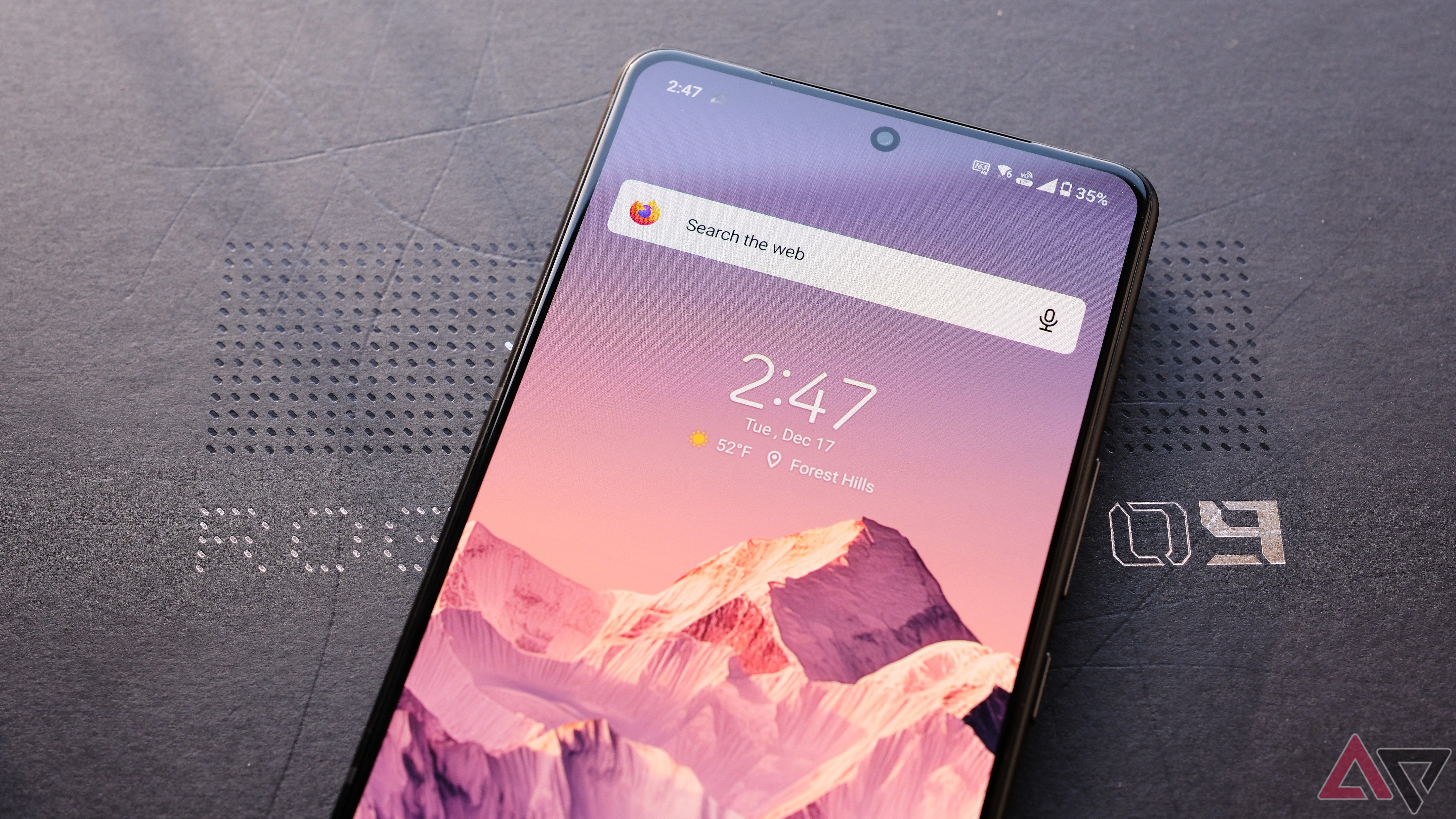 ROG Phone 9 Pro showing screen on top of box