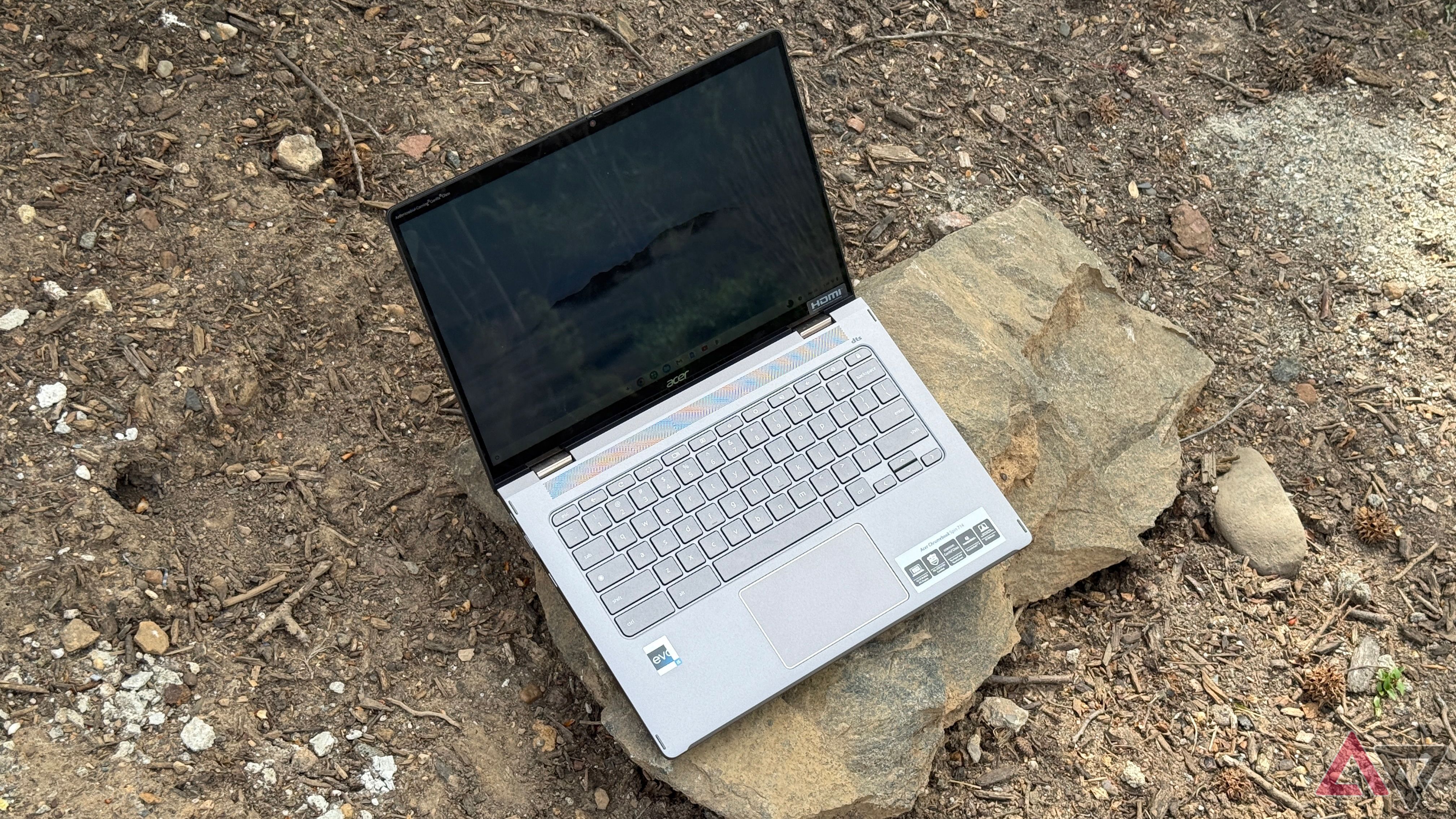 Acer Chromebook Spin 714 (2024) set on a rock with screen open in laptop mode