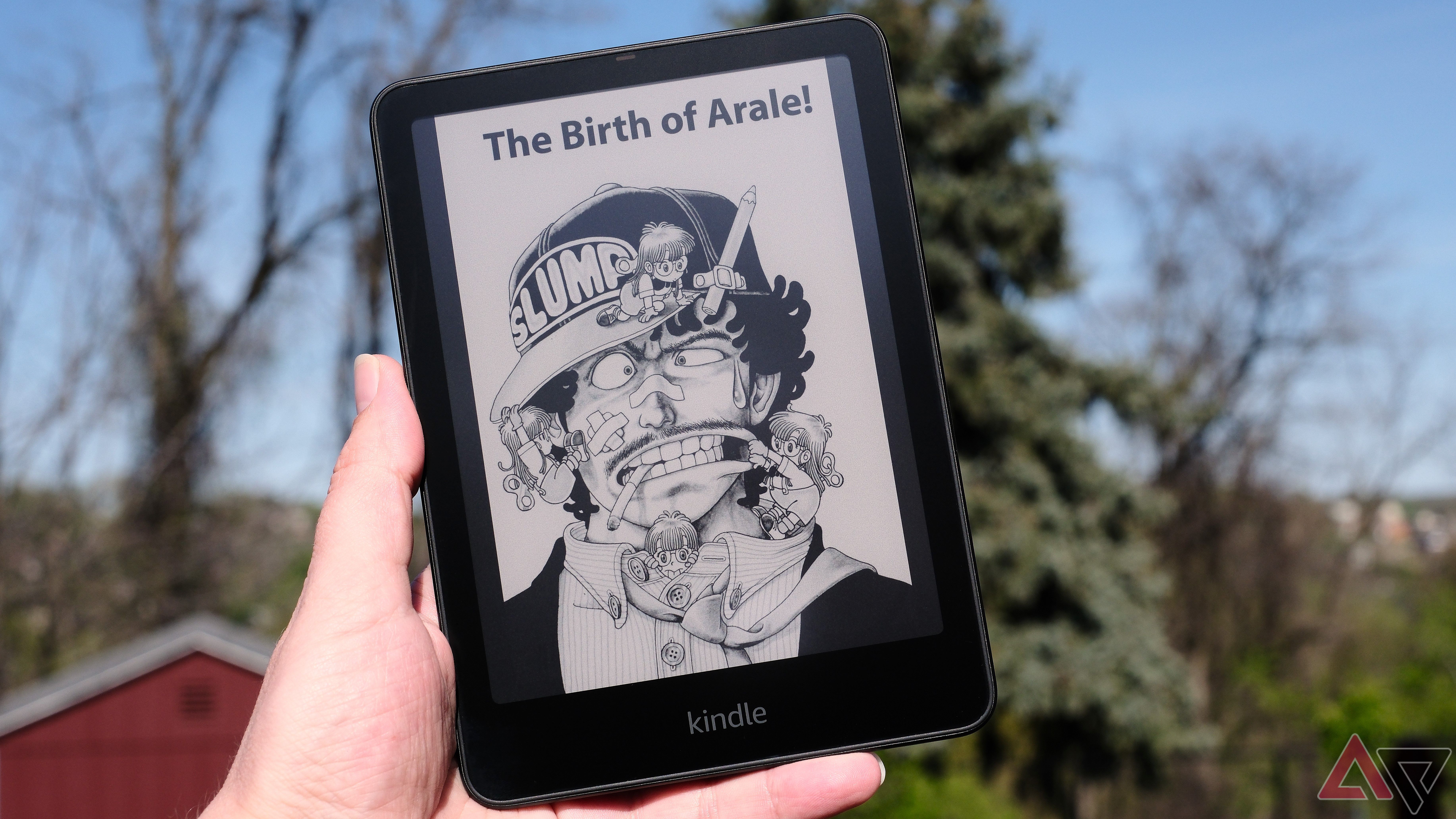 Kindle Colorsoft held in hand showing manga on screen