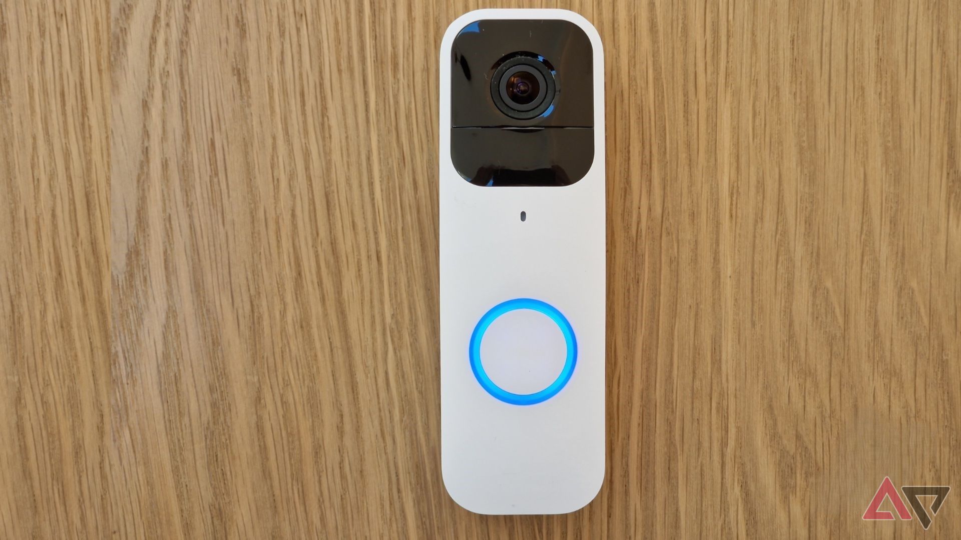 Blink video doorbell on laying on woodgrain