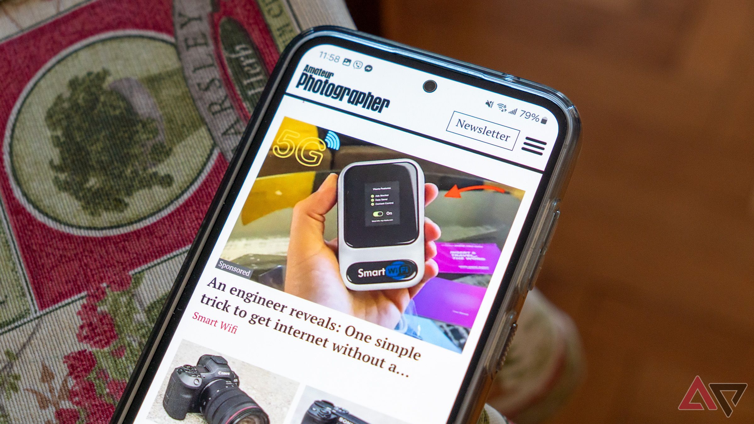 a phone on a table displaying a mobile ad
