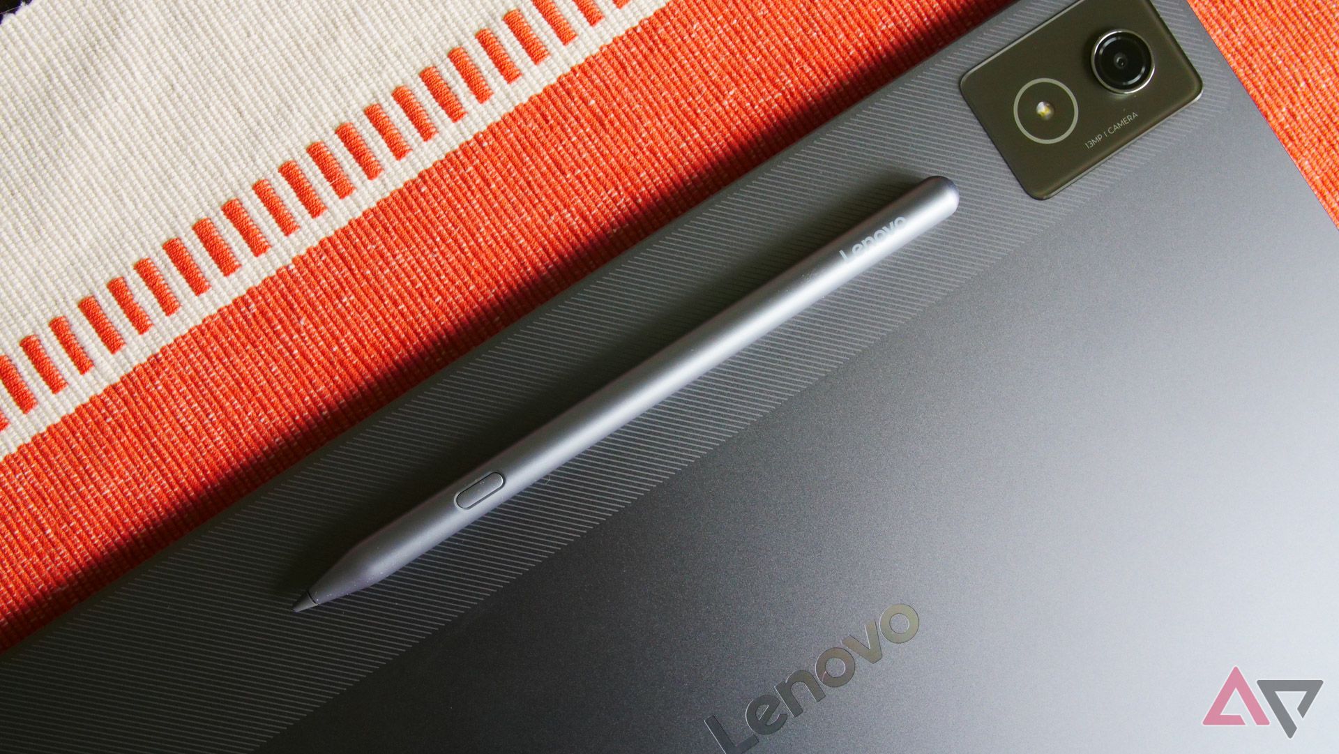 The Lenovo Idea Tab Pro face down with the stylus attached on a table.