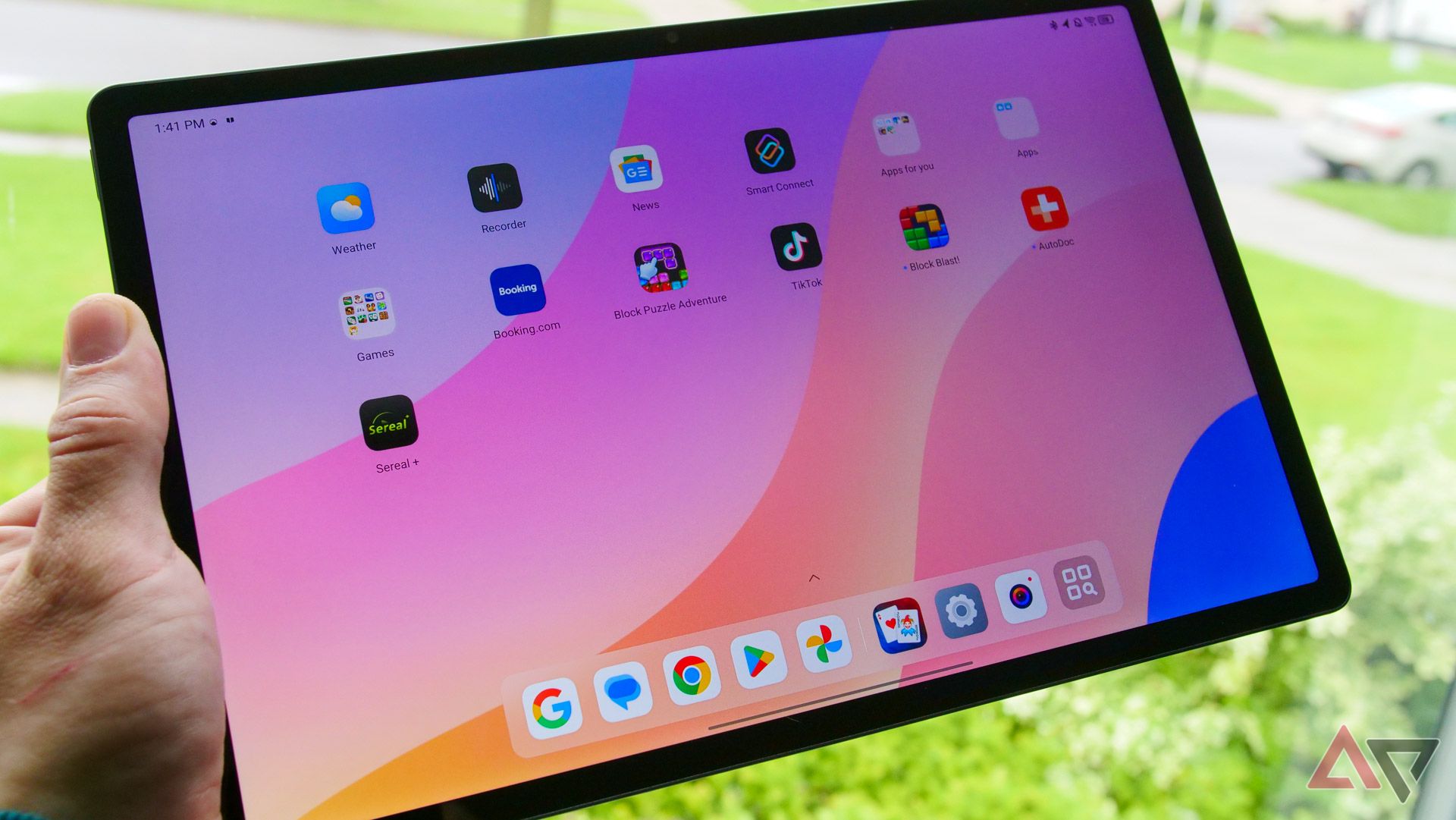 The Lenovo Idea Tab Pro in a hand with the screen on.