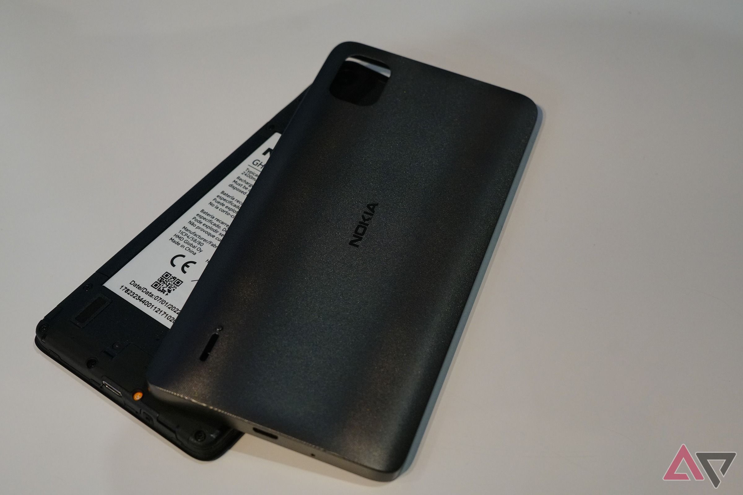 Nokia C2 with its back lid off and battery showing