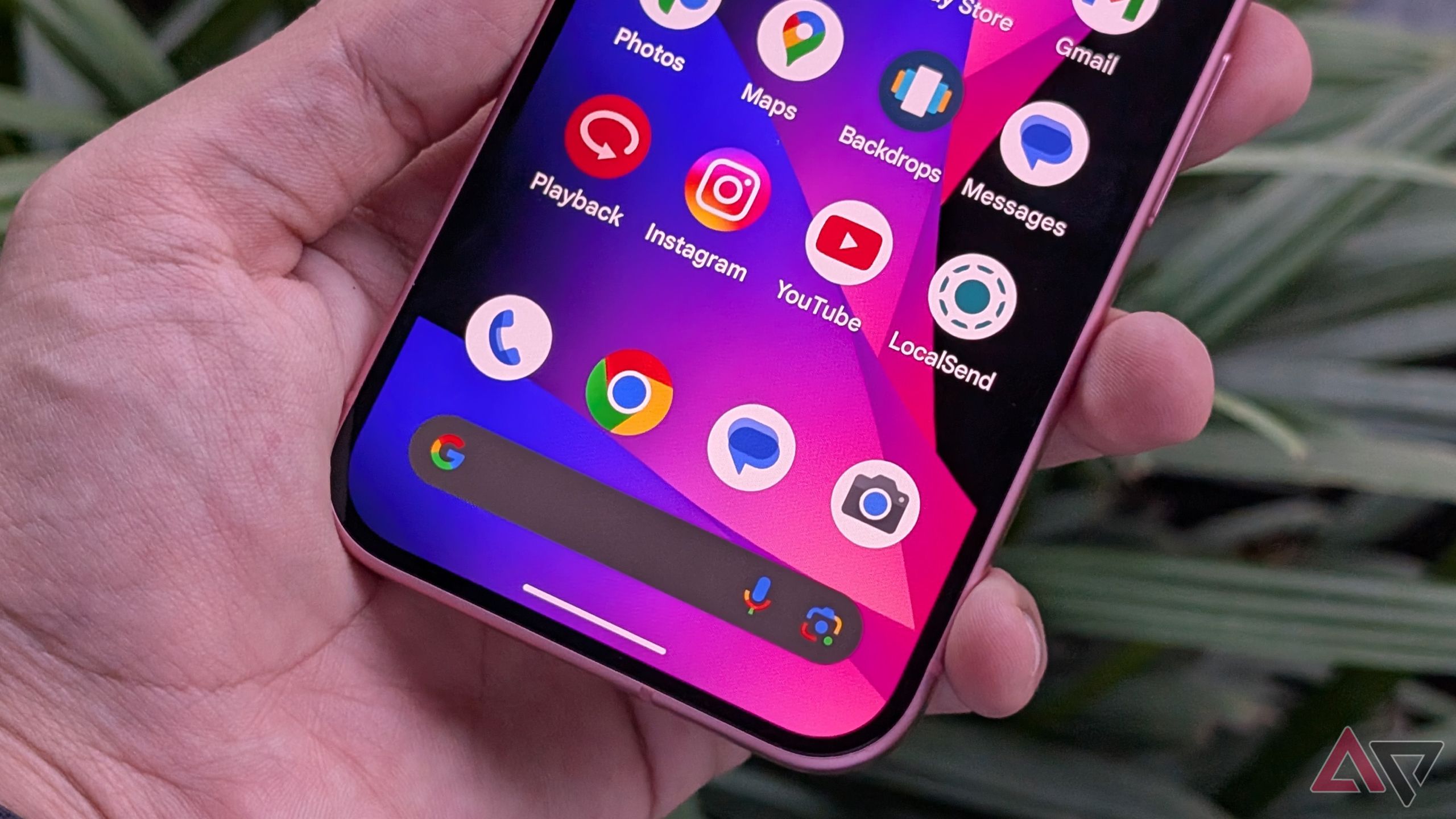 Google Pixel 9 in hand with apps like Phone, Messages, Google Chrome, and Camera shown on the home screen