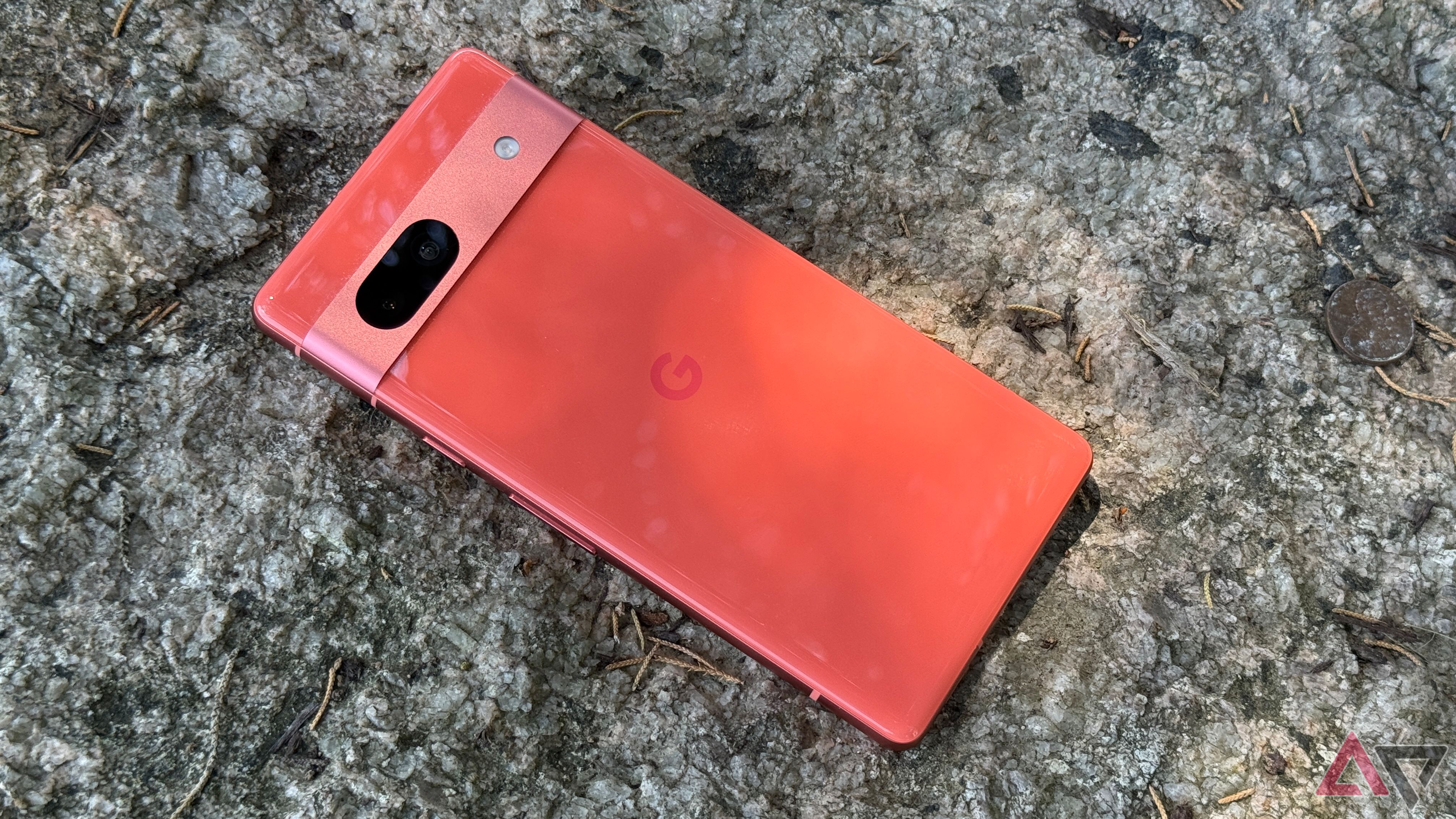 Google Pixel 7a resting face down on a rock