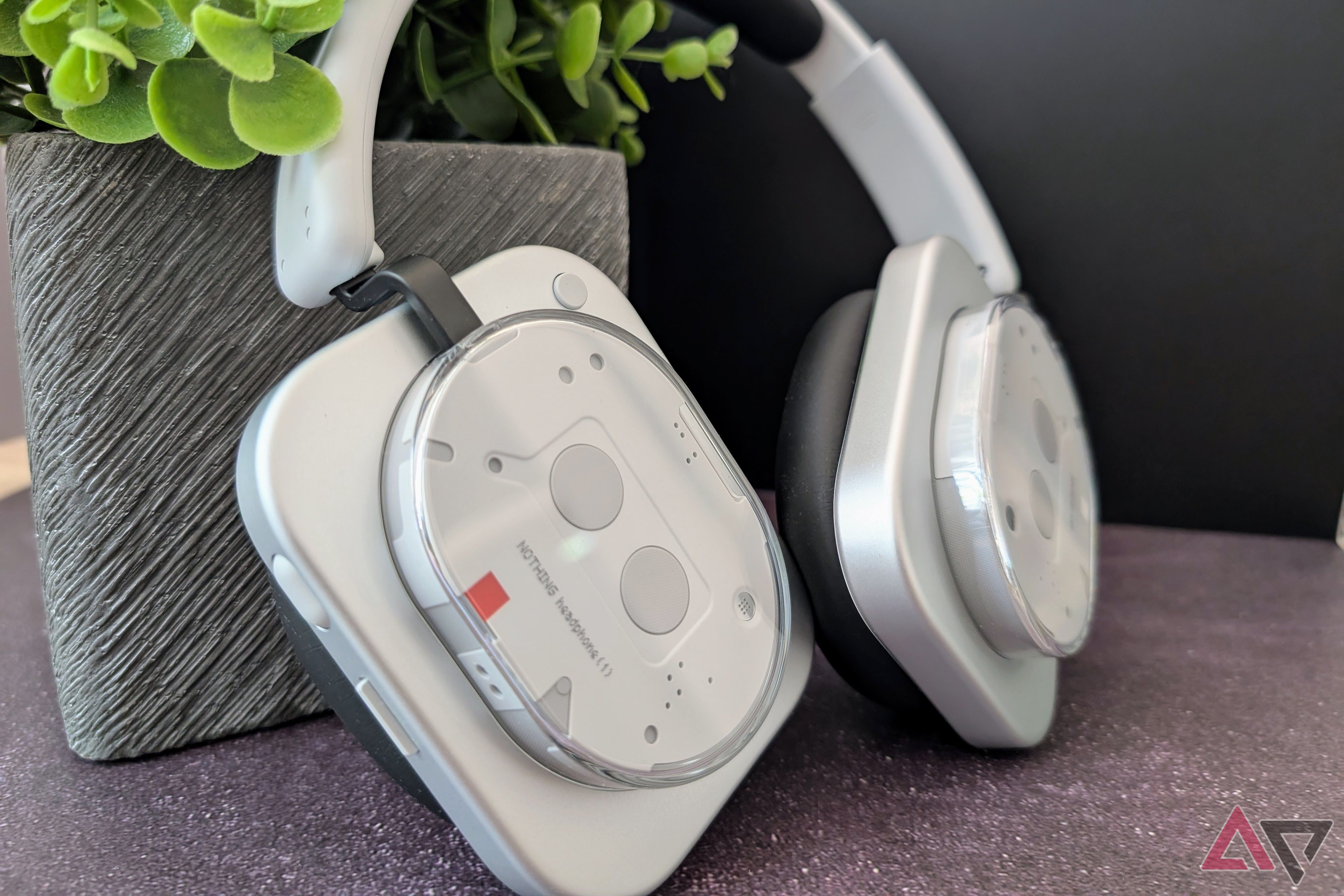 Nothing Headphones (1) leaning against a planter