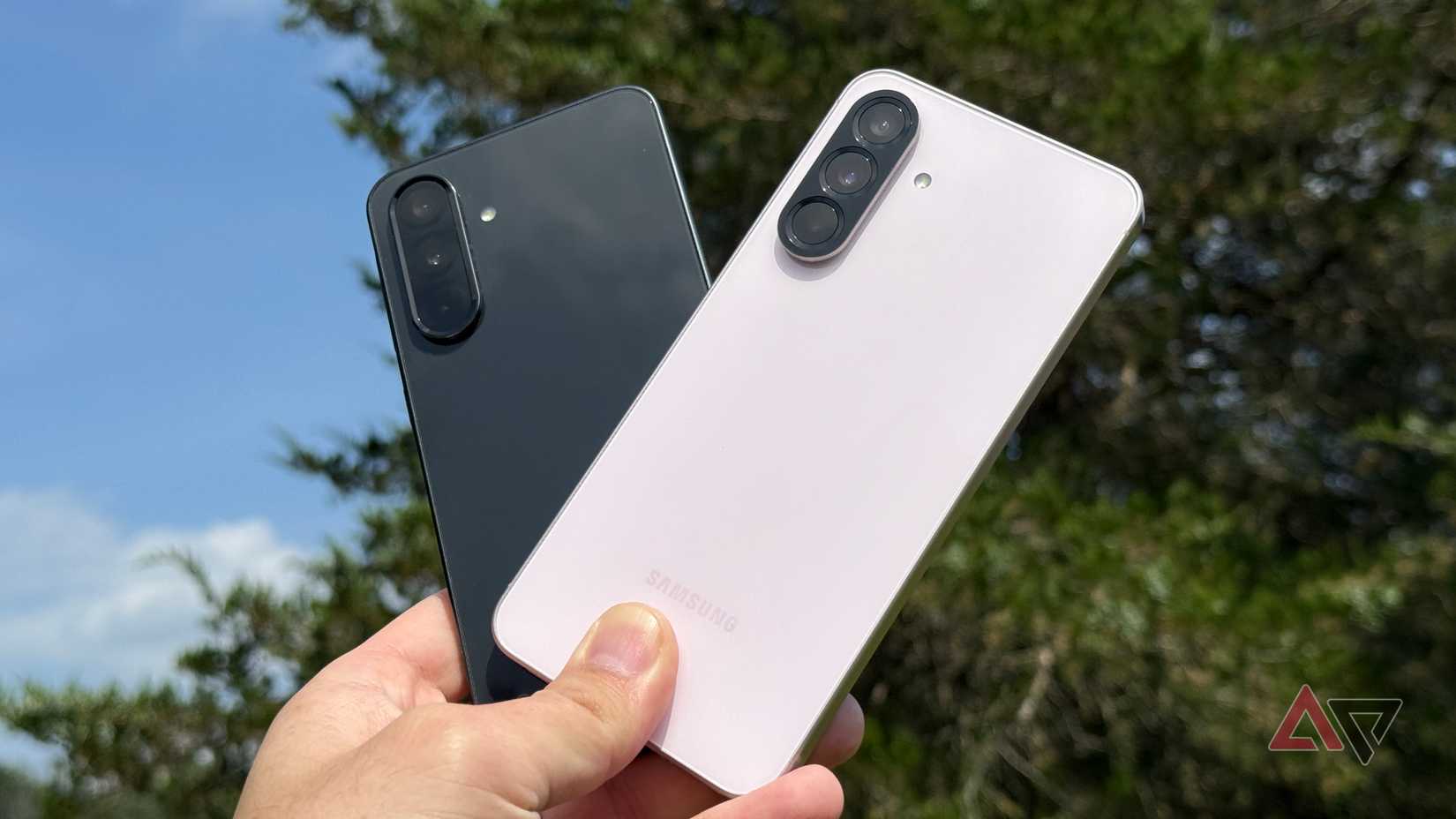 Samsung Galaxy A56 held up against a Galaxy A36