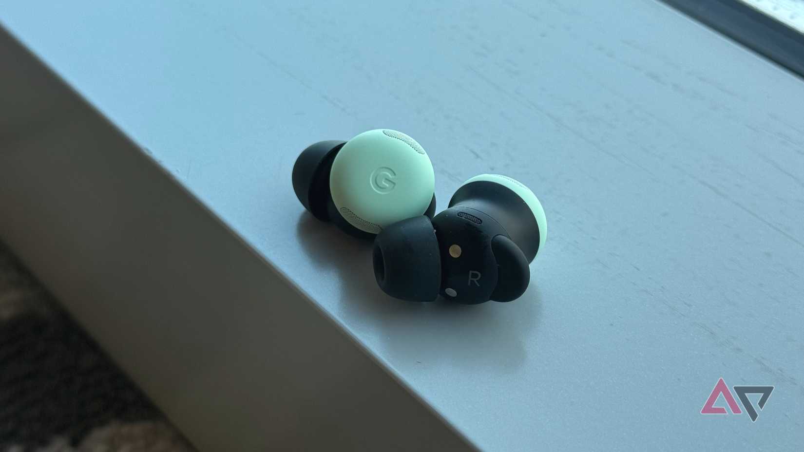 Pixel Buds Pro 2 earbuds next to a window