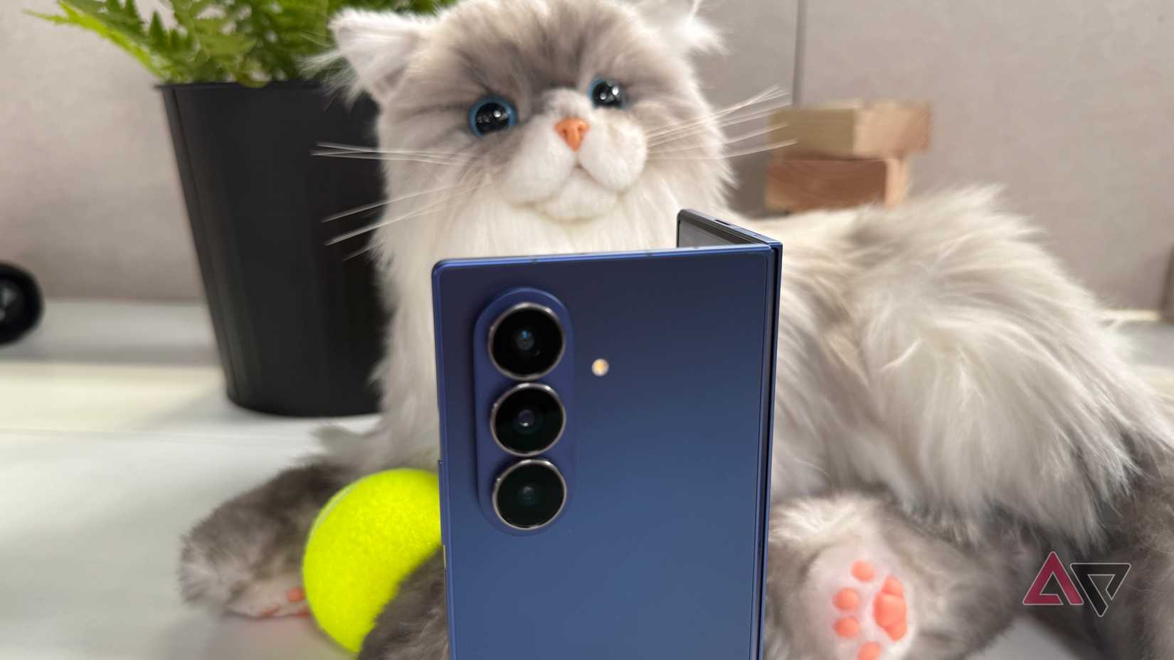 Samsung Galaxy Z Fold 7 sitting up right in the open book position showing while showing the camera lenses