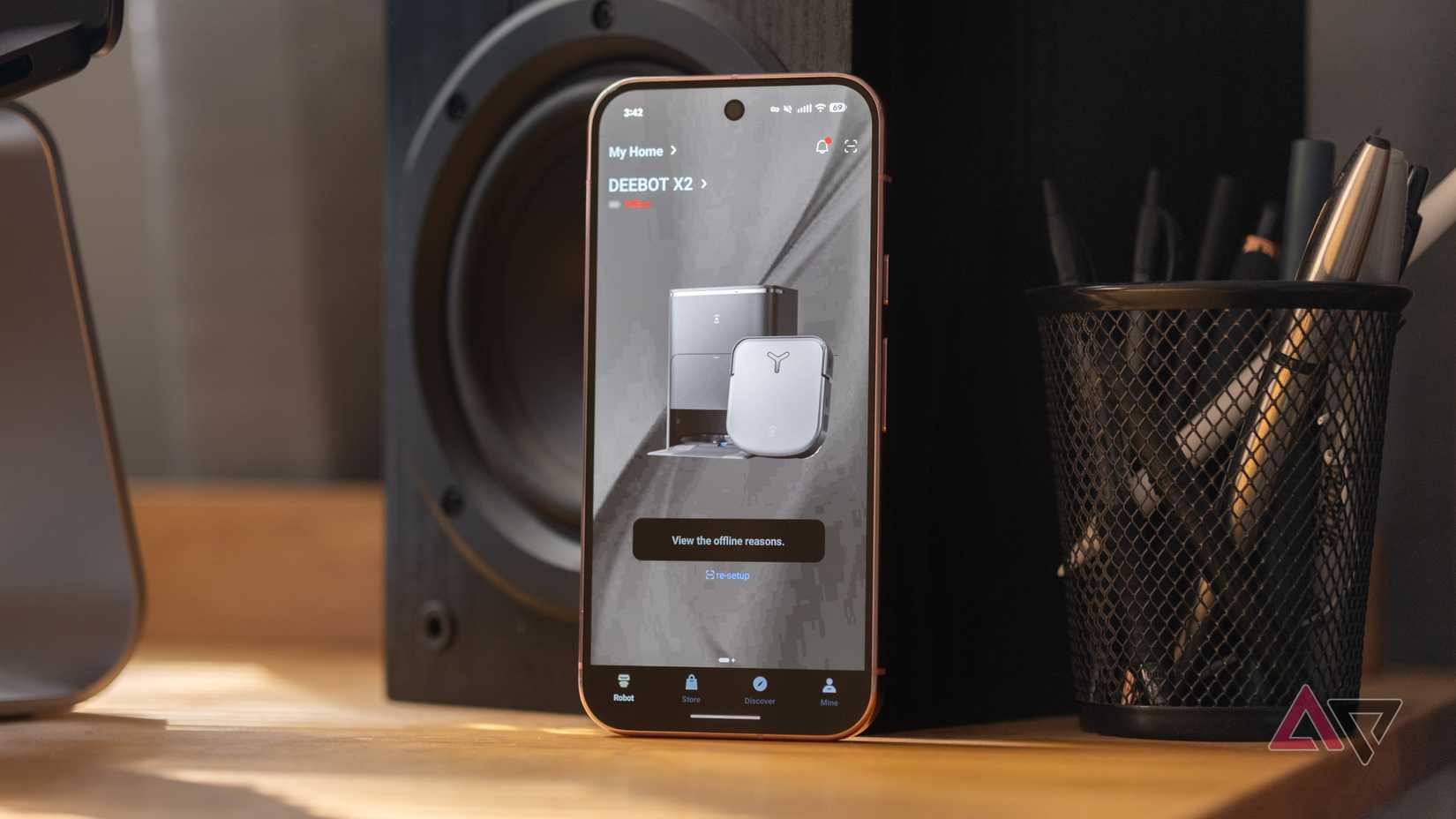 A Pixel 9 Pro showing the Ecovacs app in expanded dark theme