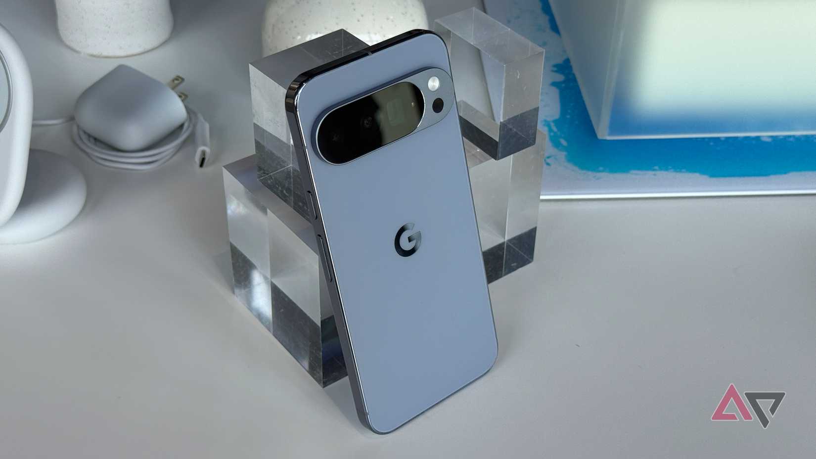 Google Pixel 10 Pro in Moonstone laying against a block