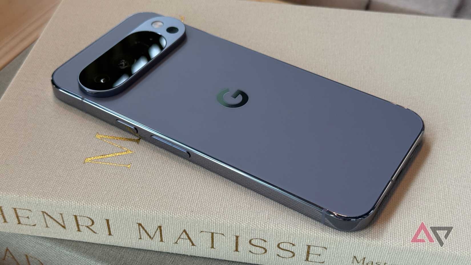 Google Pixel 10 Pro XL in Moonstone laying on a book