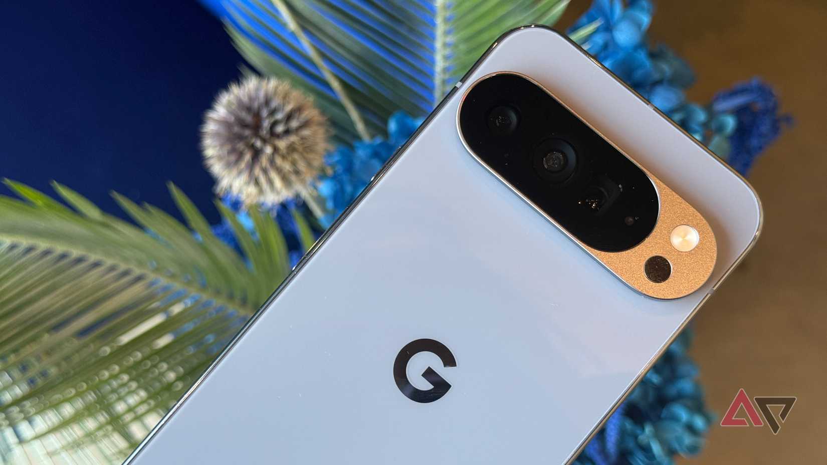 Google Pixel 10 in Frost against flowers