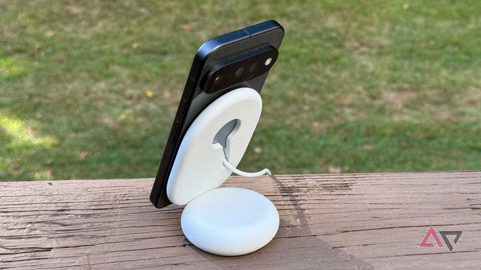 Rear view of a Google Pixel 10 on a Pixelsnap charging stand