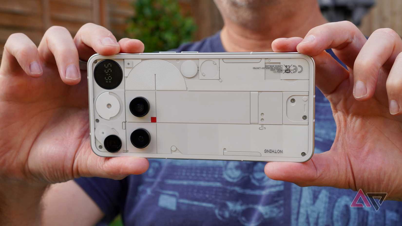 A person taking a photo with the Nothing Phone 3